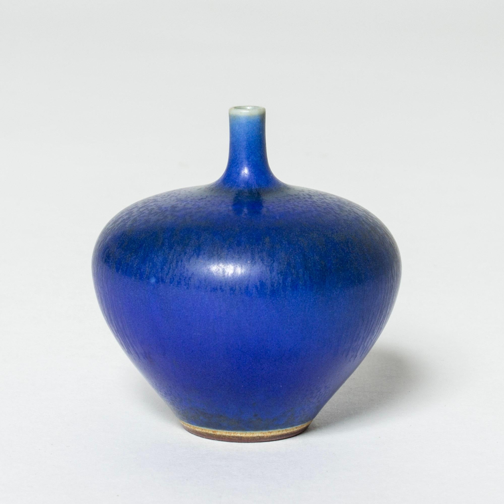 Miniature stoneware vase by Berndt Friberg in a plump apple form. Vibrant blue hare’s fur glaze.

Berndt Friberg was a Swedish ceramicist, renowned for his stoneware vases and vessels for Gustavsberg. His pure, composed designs with satiny,