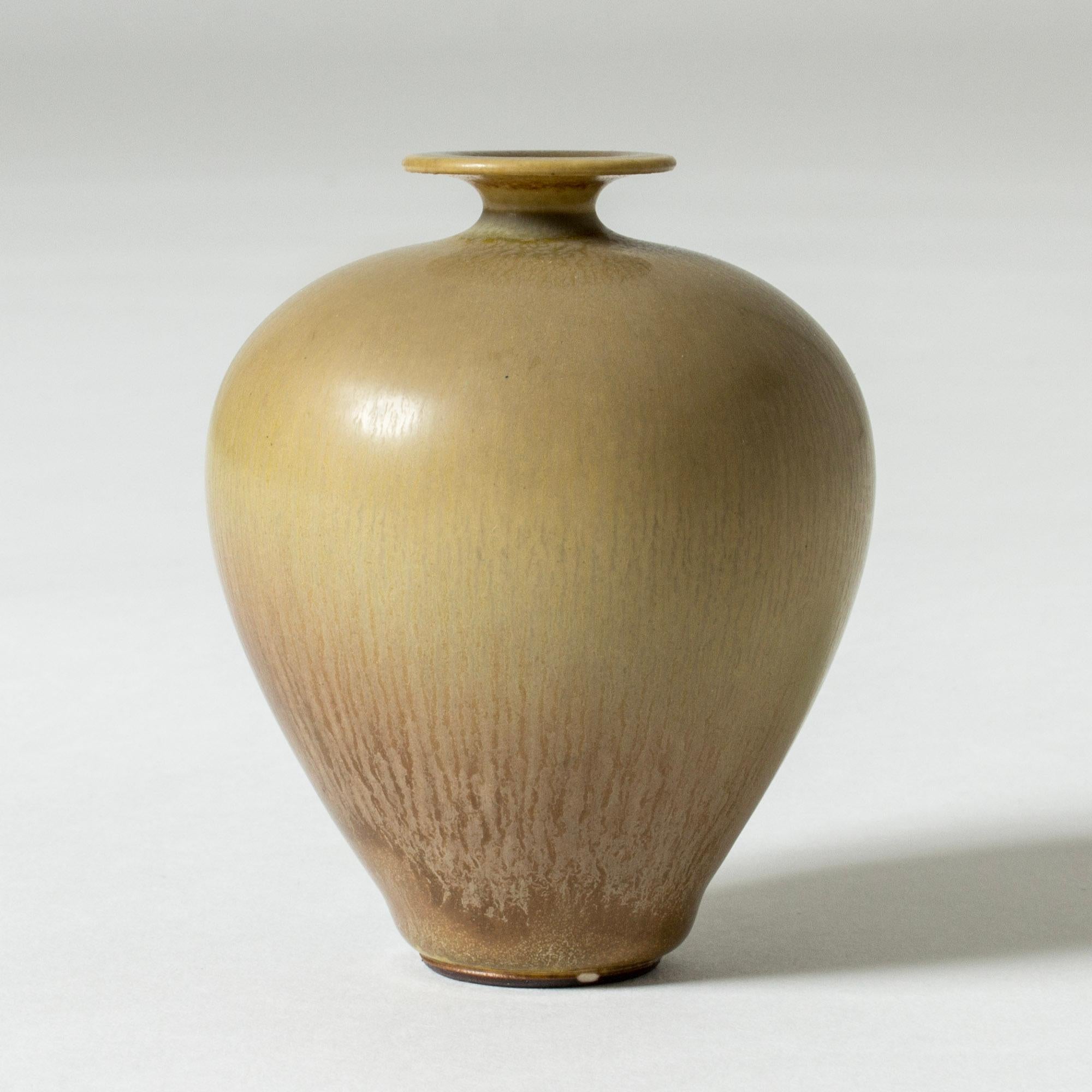 Miniature stoneware vase by Berndt Friberg, in an elegant form. Beige and brown hare’s fur glaze.

Berndt Friberg was a Swedish ceramicist, renowned for his stoneware vases and vessels for Gustavsberg. His pure, composed designs with satiny,