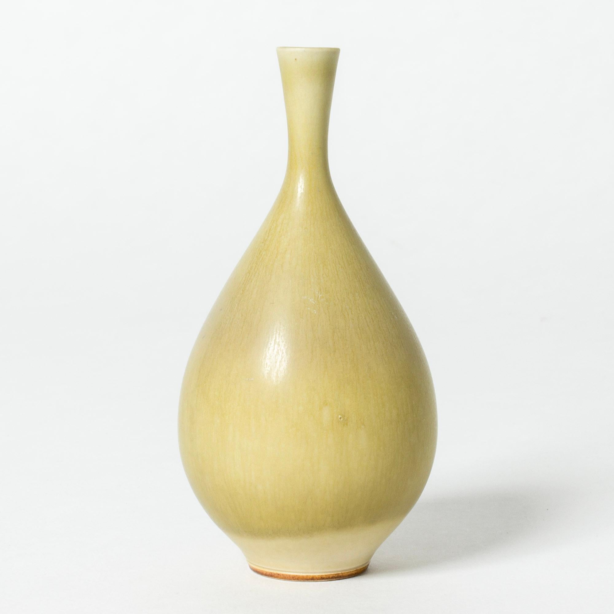Lovely stoneware vase by Berndt Friberg in a smooth, bulbous form. Pale yellow hare’s fur glaze.

Berndt Friberg was a Swedish ceramicist, renowned for his stoneware vases and vessels for Gustavsberg. His pure, composed designs with satiny,