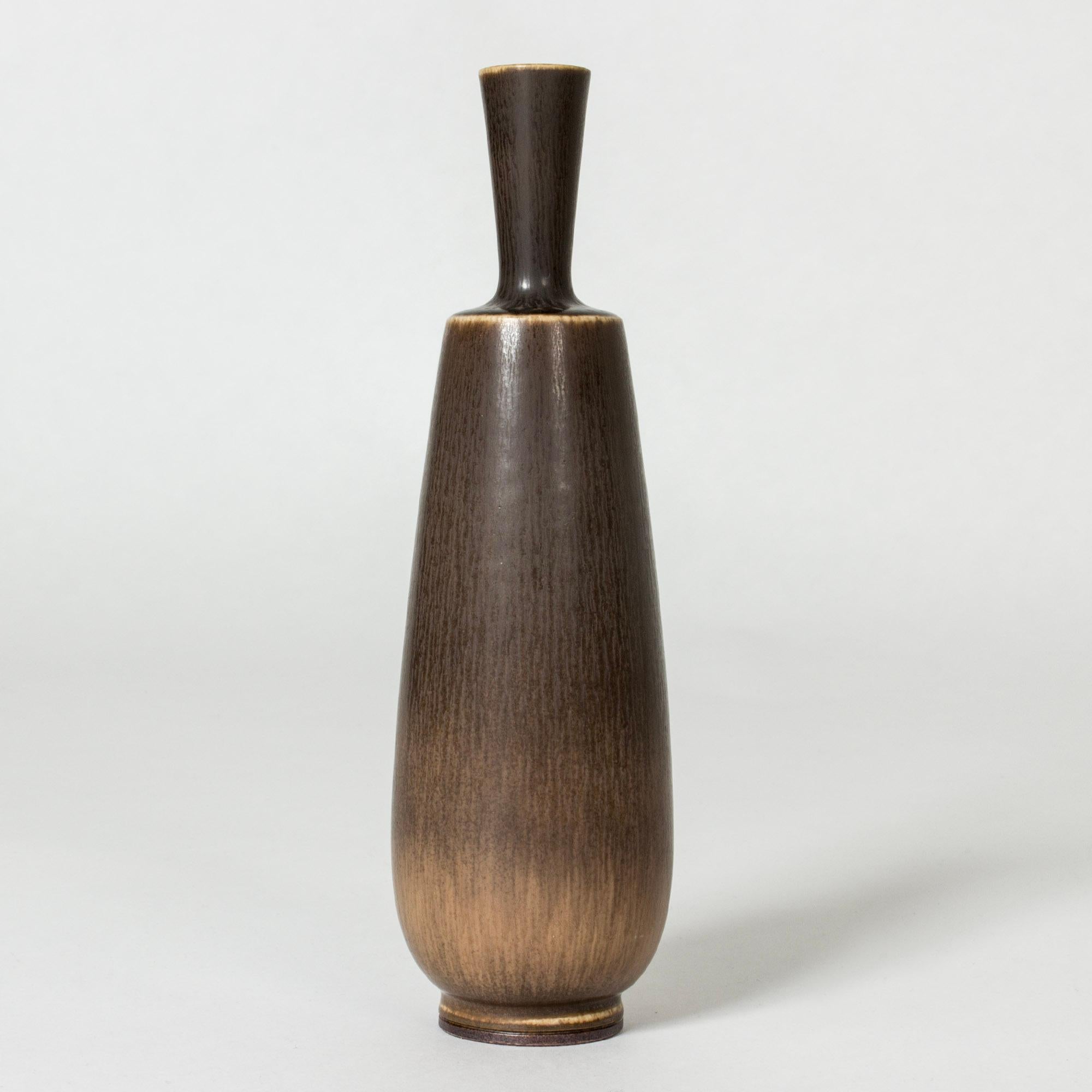 Stoneware vase by Berndt Friberg in an elegant shape with both plumpness and strictness. Rich dark brown hare’s fur glaze.

Berndt Friberg was a Swedish ceramicist, renowned for his stoneware vases and vessels for Gustavsberg. His pure, composed