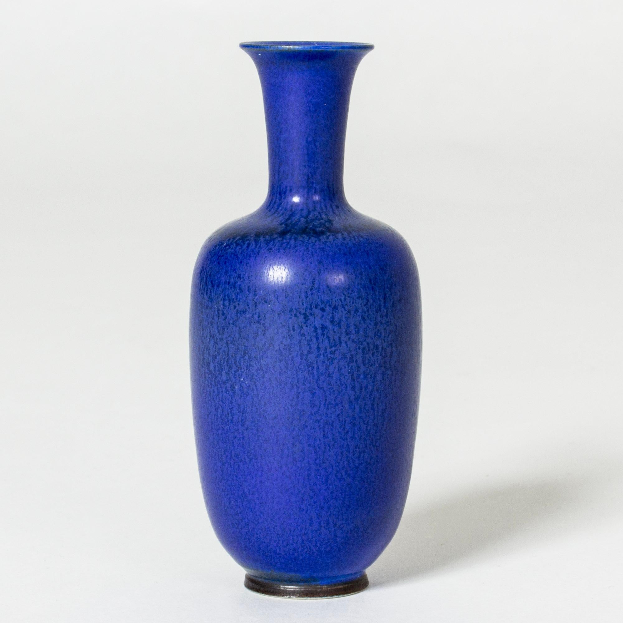 Small stoneware vase by Berndt Friberg, in an elegant, classic form with bright blue hare’s fur glaze.

Berndt Friberg was a Swedish ceramicist, renowned for his stoneware vases and vessels for Gustavsberg. His pure, composed designs with satiny,