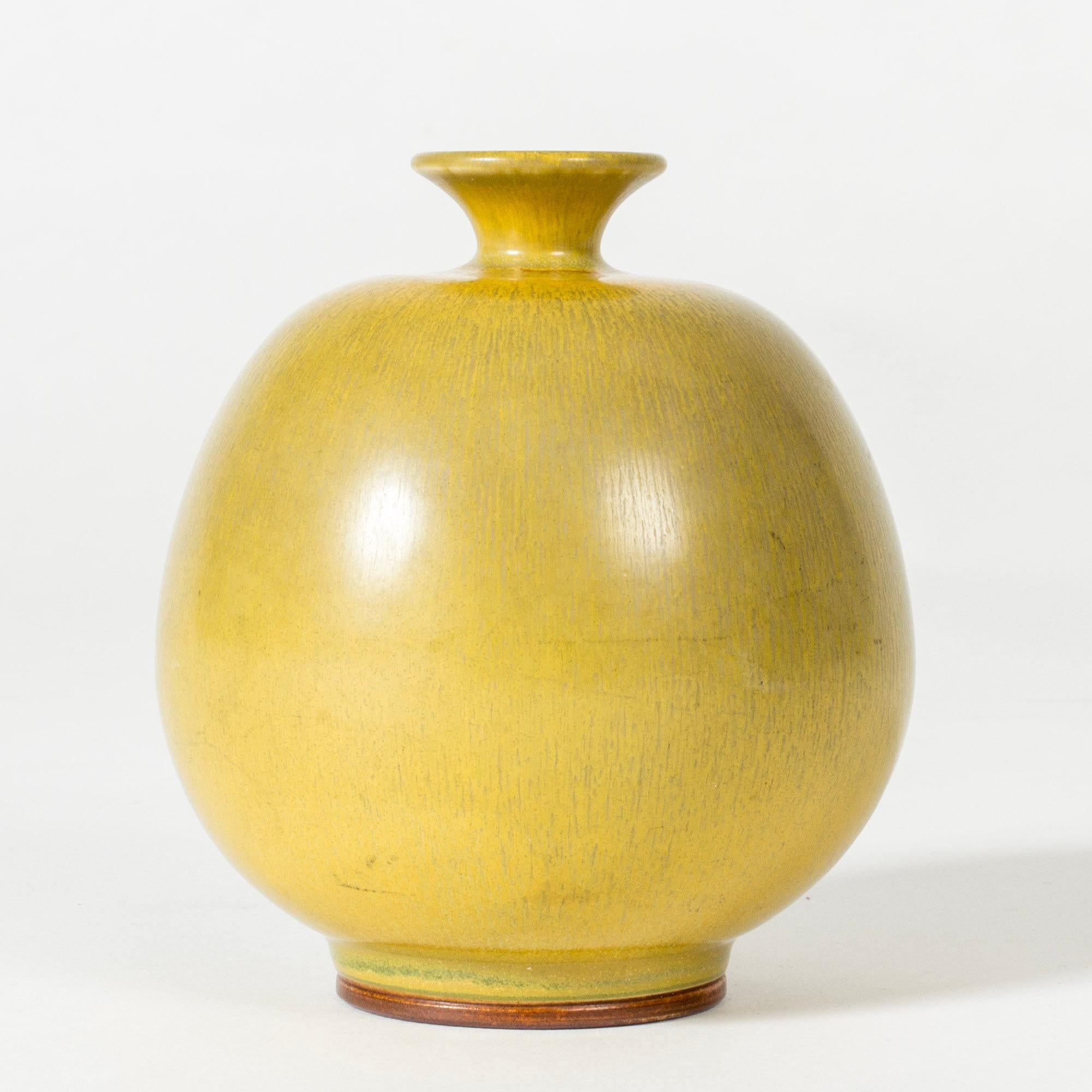 Stoneware vase by Berndt Friberg, in an ample, compact form. Decorated with yellow hare’s fur glaze.

Berndt Friberg was a Swedish ceramicist, renowned for his stoneware vases and vessels for Gustavsberg. His pure, composed designs with satiny,