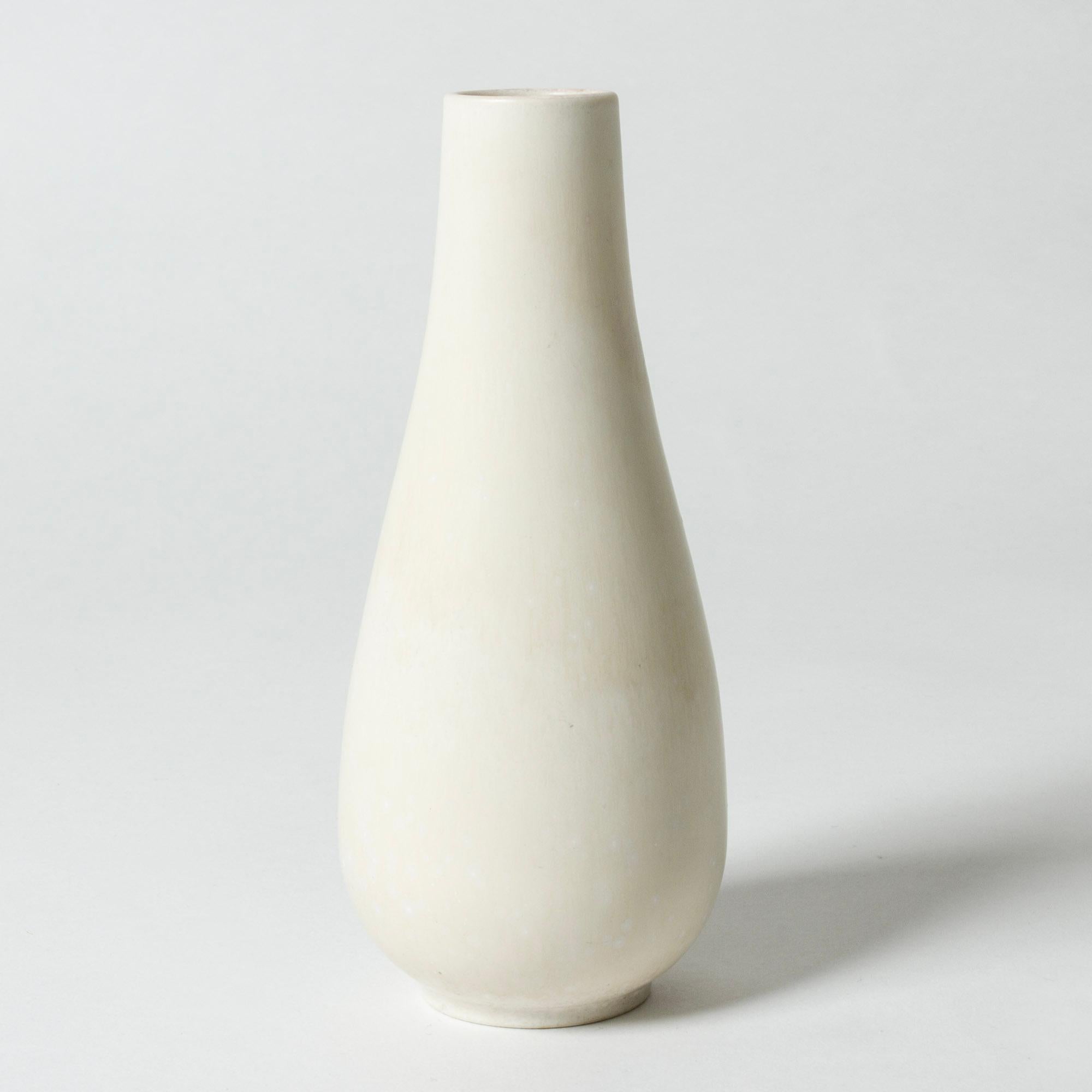 Lovely stoneware vase by Gunnar Nylund, in a smooth modernist form. Glazed eggshell white.

Gunnar Nylund was one of the most influential ceramicists and designers of the Swedish mid-century period. He was Rörstrand’s creative leader from 1931