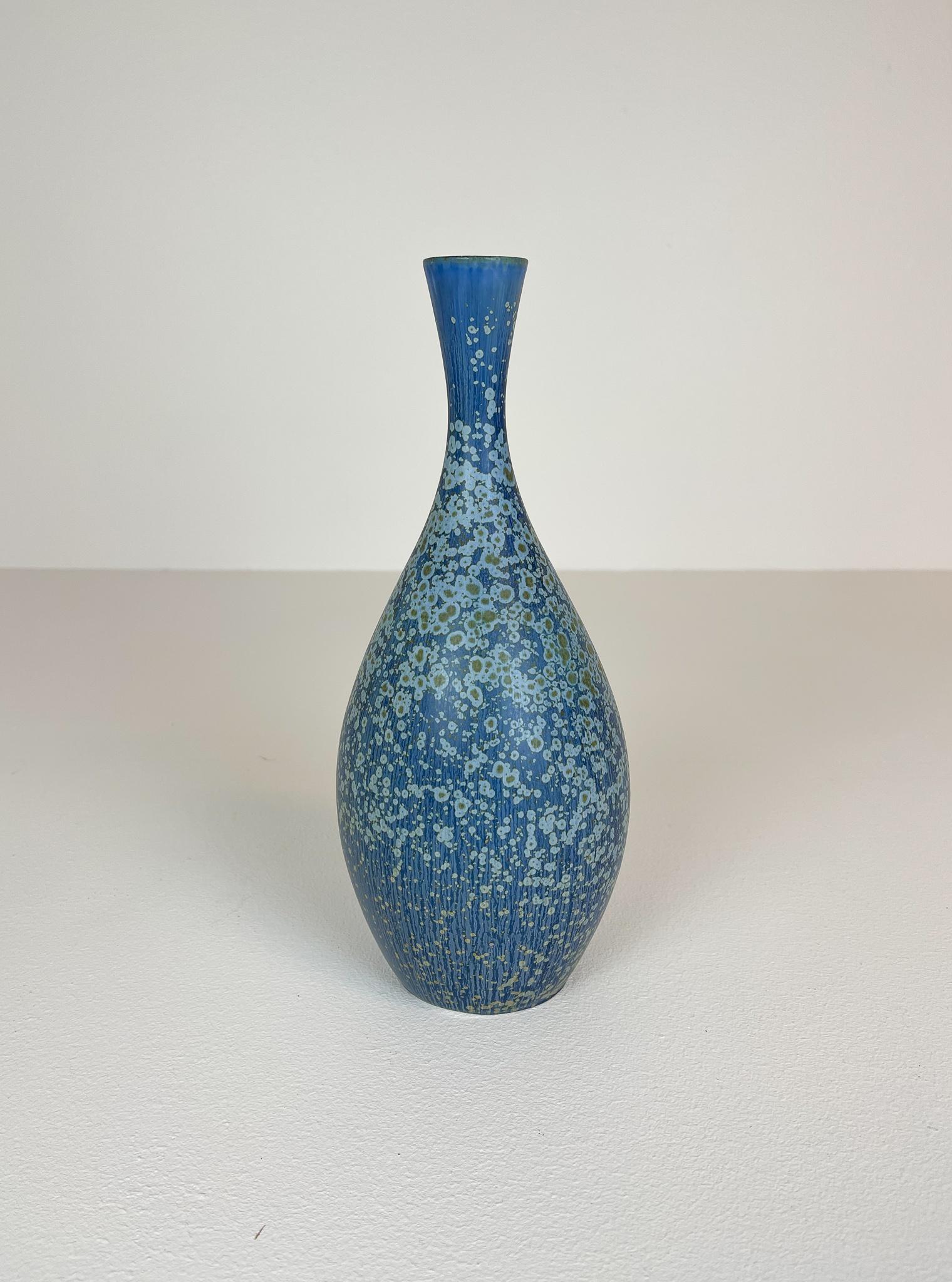 This stunning piece of ceramic was produced at Rörstrand and maker/designer Carl Harry Stålhane. Made in Sweden in the 1950s. Exceptional beautiful blue glazed vases with nice lines. Its rounded bottom with blue glaze and light blue green dots, the