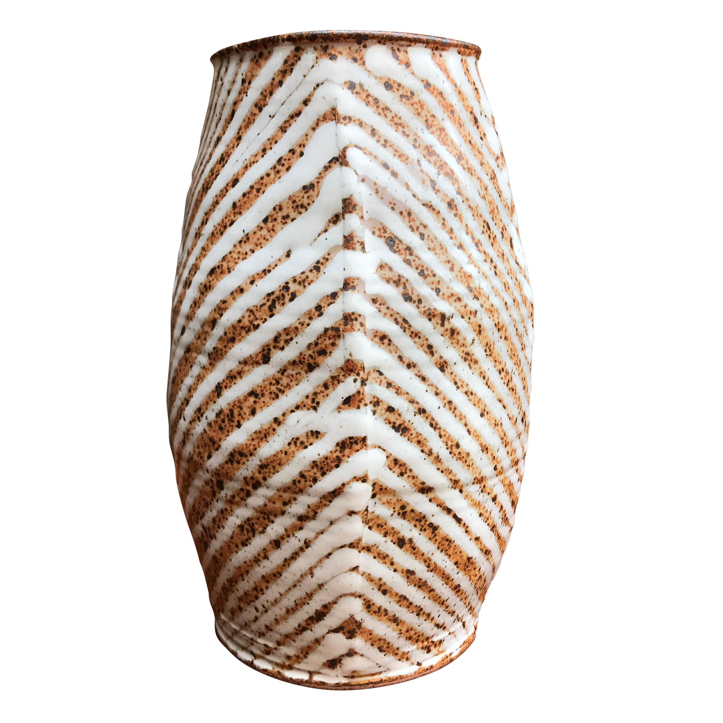 A wonderful mid-20th century wheel-thrown studio pottery vase with vertical ridges at each 