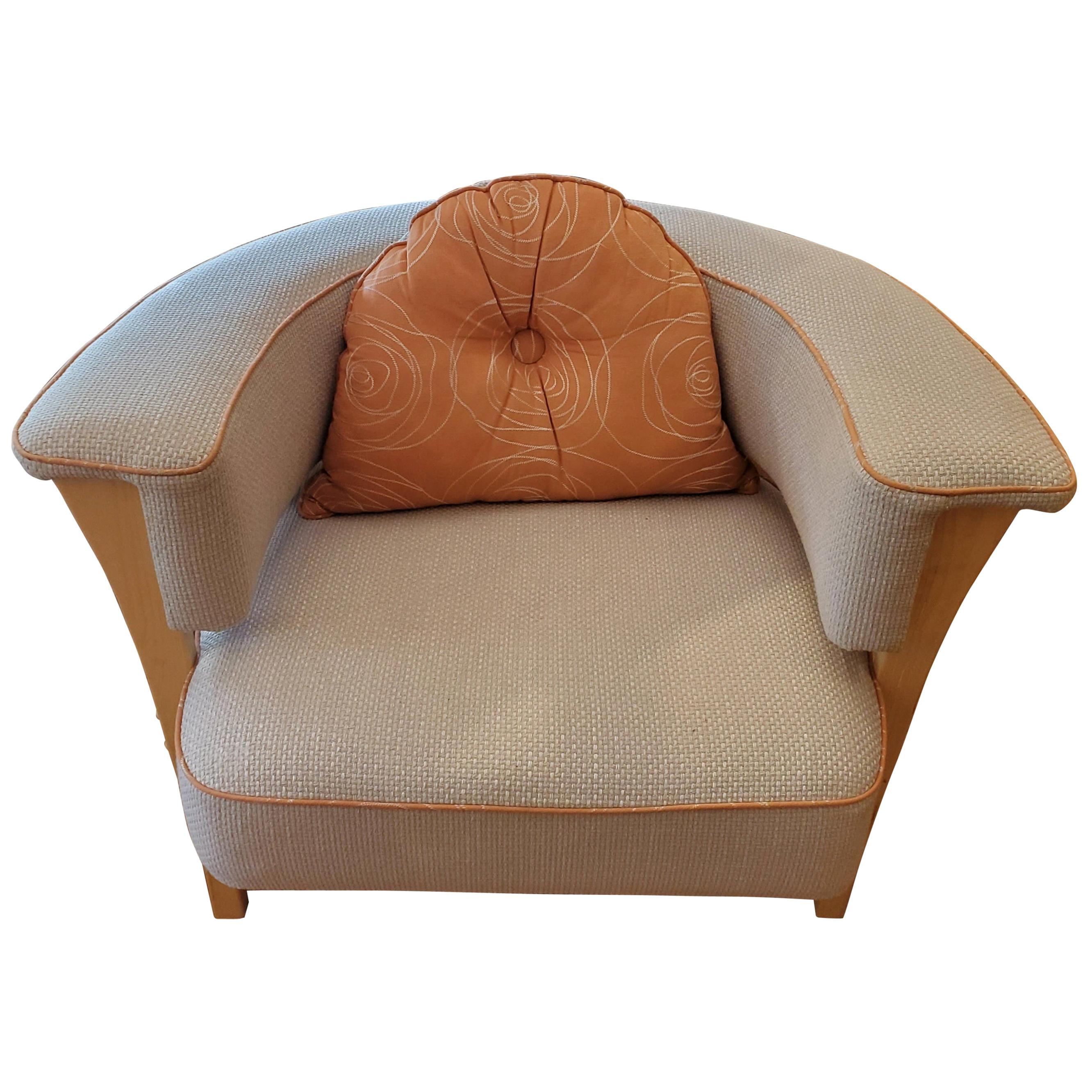 Called the “Viking Chair,” this Mid-Century Modern style armchair is extremely comfortable and will be a fabulous addition to your sitting room. Styled after a 1960s Danish design, it is upholstered in natural linen with orange piping and an orange