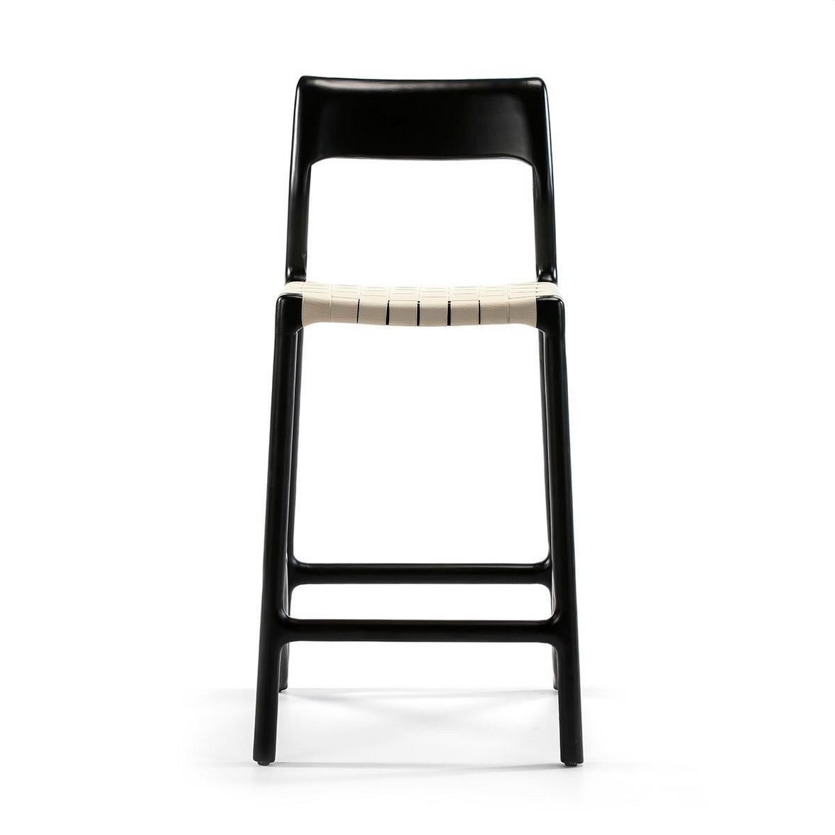 Midcentury style and Danish design black lacquered wood and white canvas counter stool.