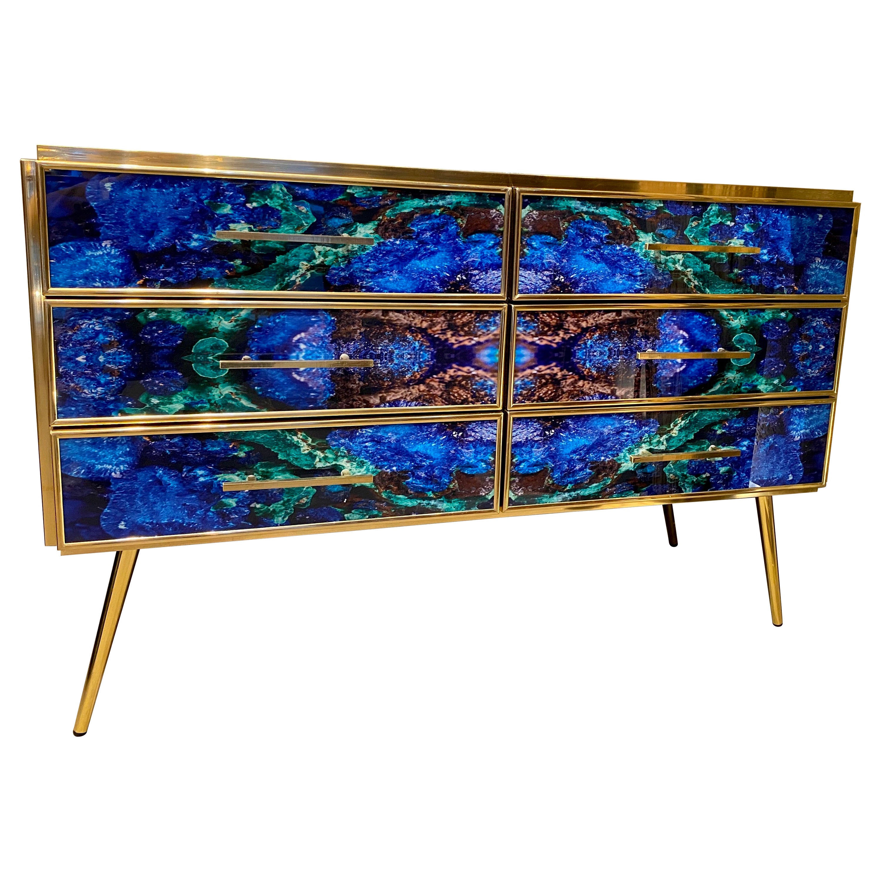Striking brass frame and handcut Lapis lazuli imitation Murano glass Commode or chest of drawer, raised on special brass legs. 
Handmade by a master artisan.
Price is for one item. 