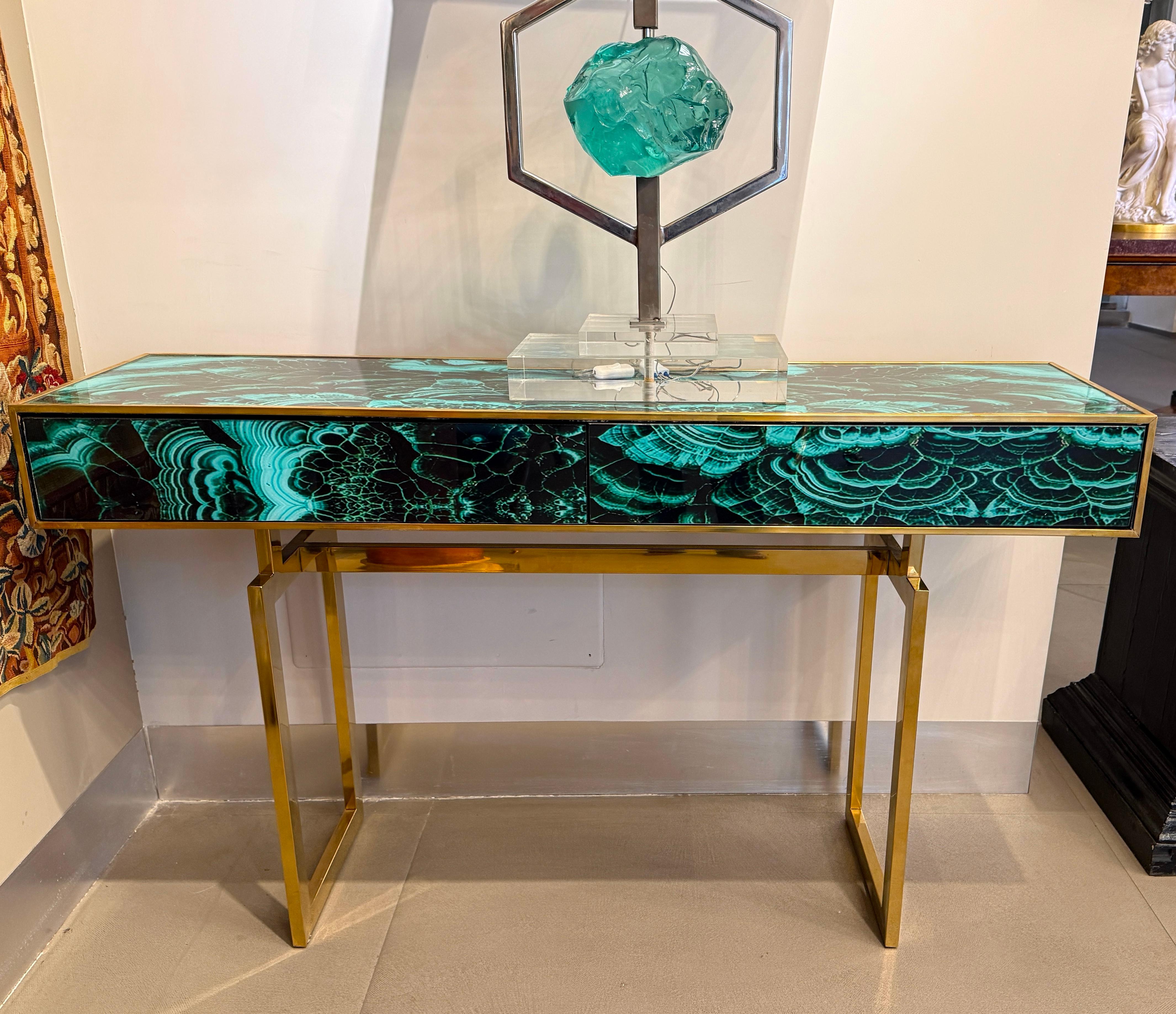 Striking brass frame and hand-cut Malachite imitation Murano glass Console  table with two drawers, raised on special brass legs. 
Handmade by a master artisan.
Price is for one item. 
 Available also  a pair .