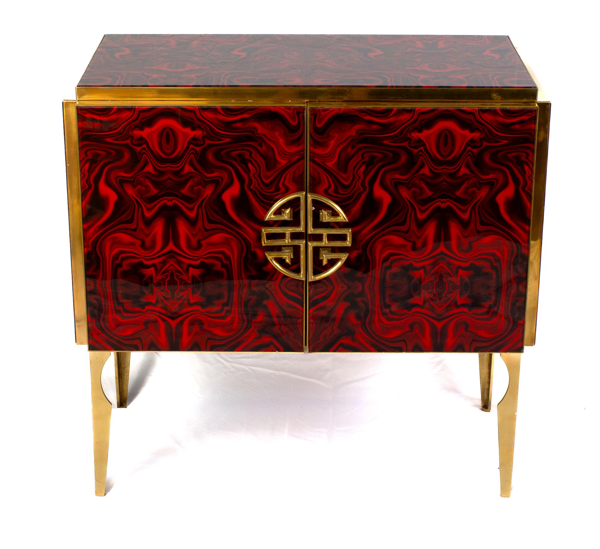 Very fine handmade bar cabinet by a master artisan. Brass frame with handmade and hand-cut ruby red flower fantasy  Murano glass ,raised on special brass legs.
