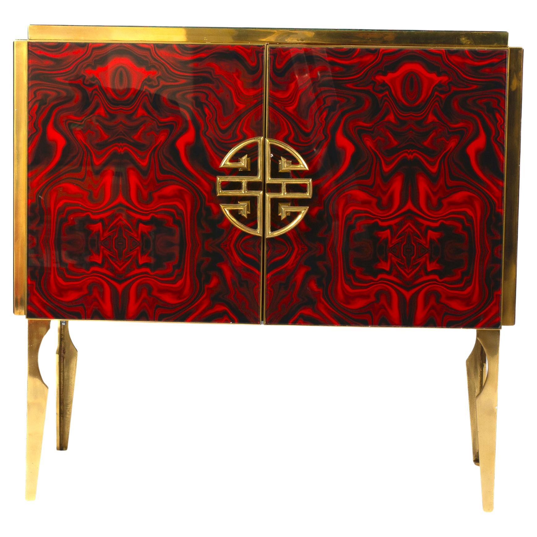 Very fine handmade bar cabinet by a master artisan. Brass frame with handmade and hand-cut ruby red flower fantasy  Murano glass ,raised on special brass legs.
