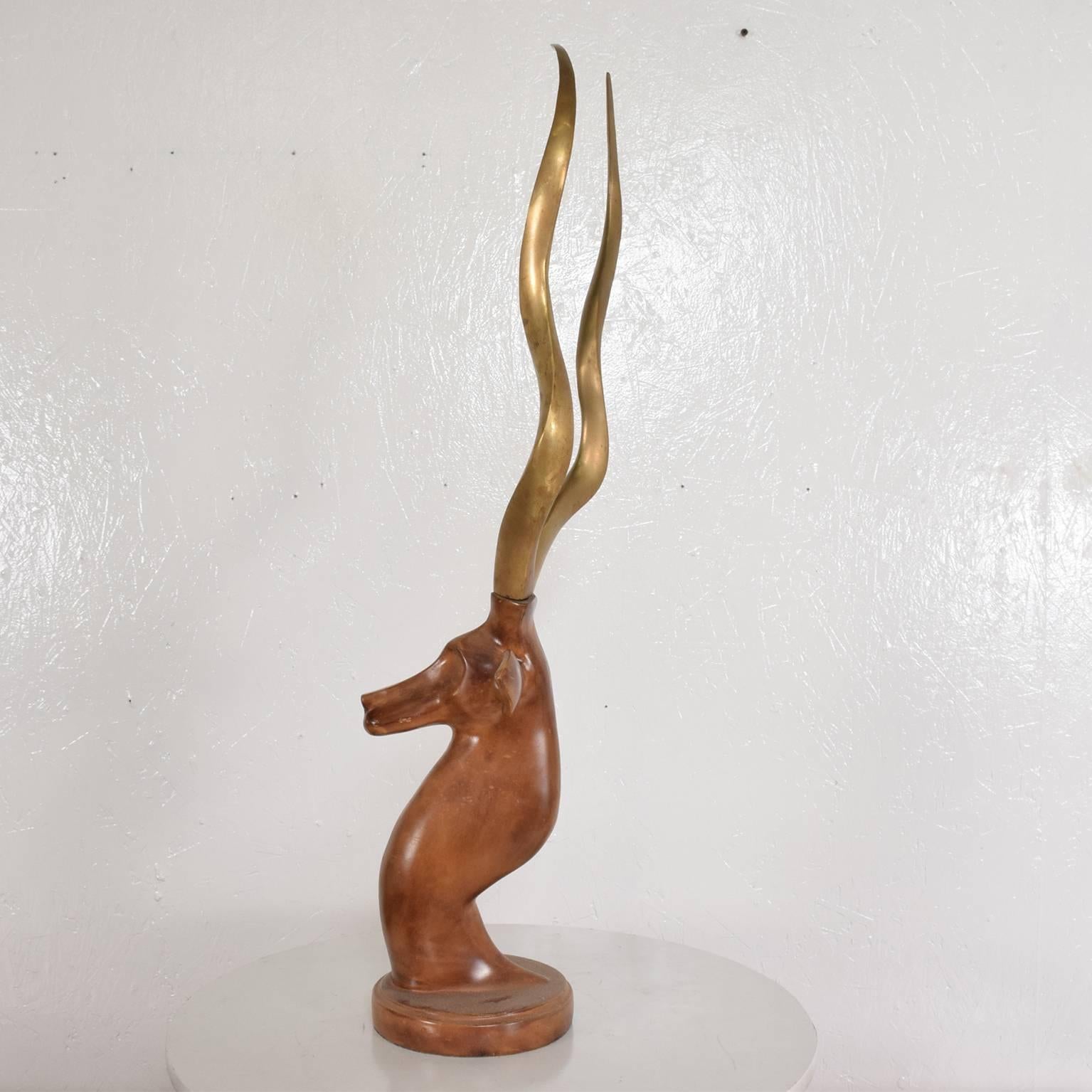 For your consideration a beautiful metal gazelle with brass antlers,
circa 1980s.
Measure: 28'in H x 7.4