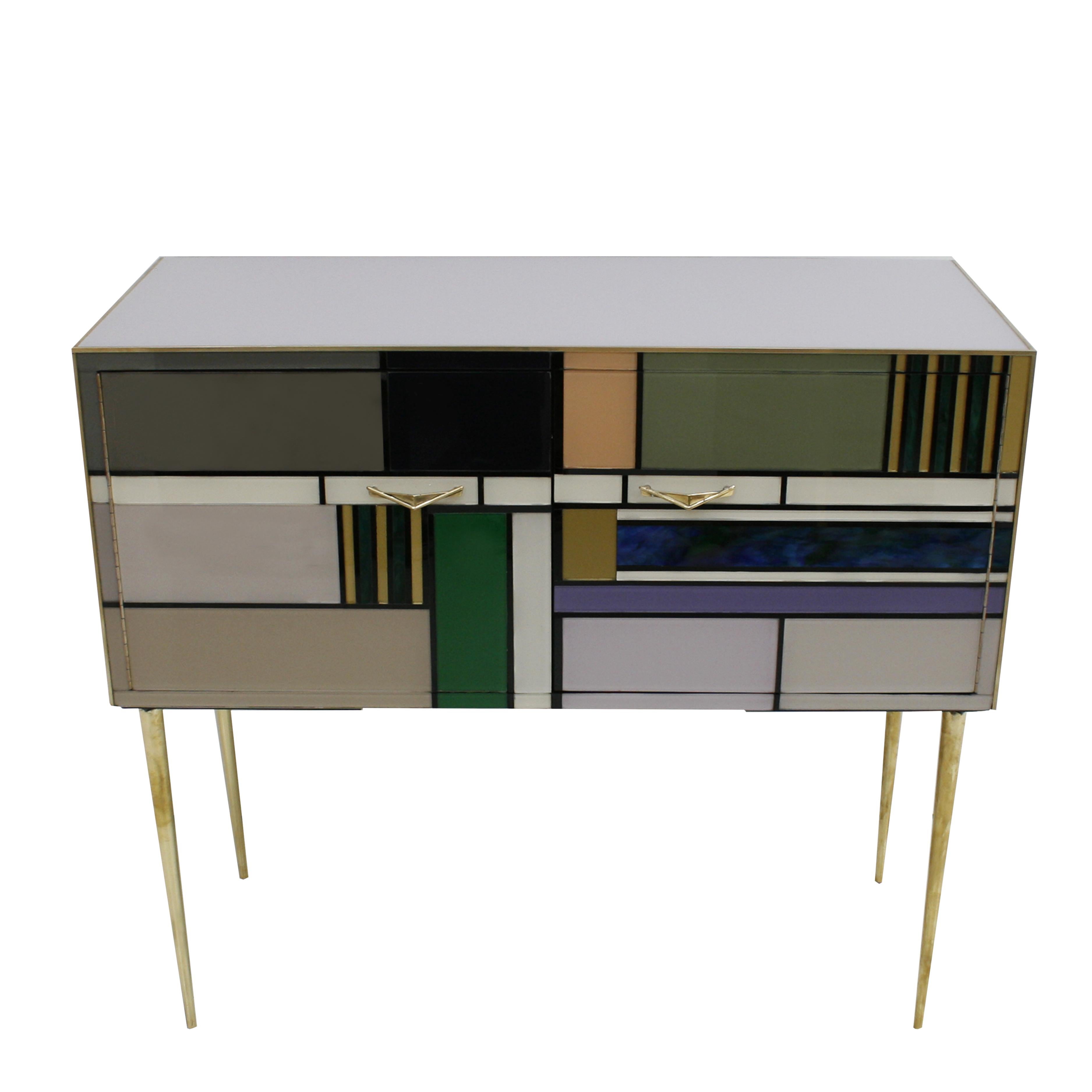Pair of Italian sideboards composed of two folding doors. Structure made of solid wood covered in colored glass. Profiles, handles and legs are made of solid brass.