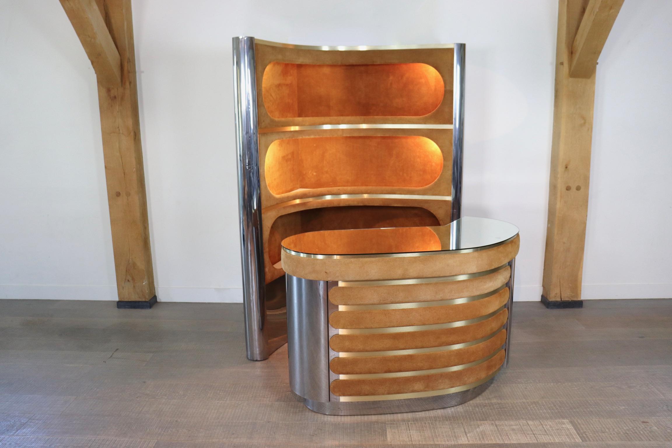 Incredible suede and chrome bar by Willy Rizzo 1970s. With original mirror counter, working lights and original refrigerator. With this bar, any room will be elevated to a classy and luxurious space. Pour yourself a cold drink and enjoy the night