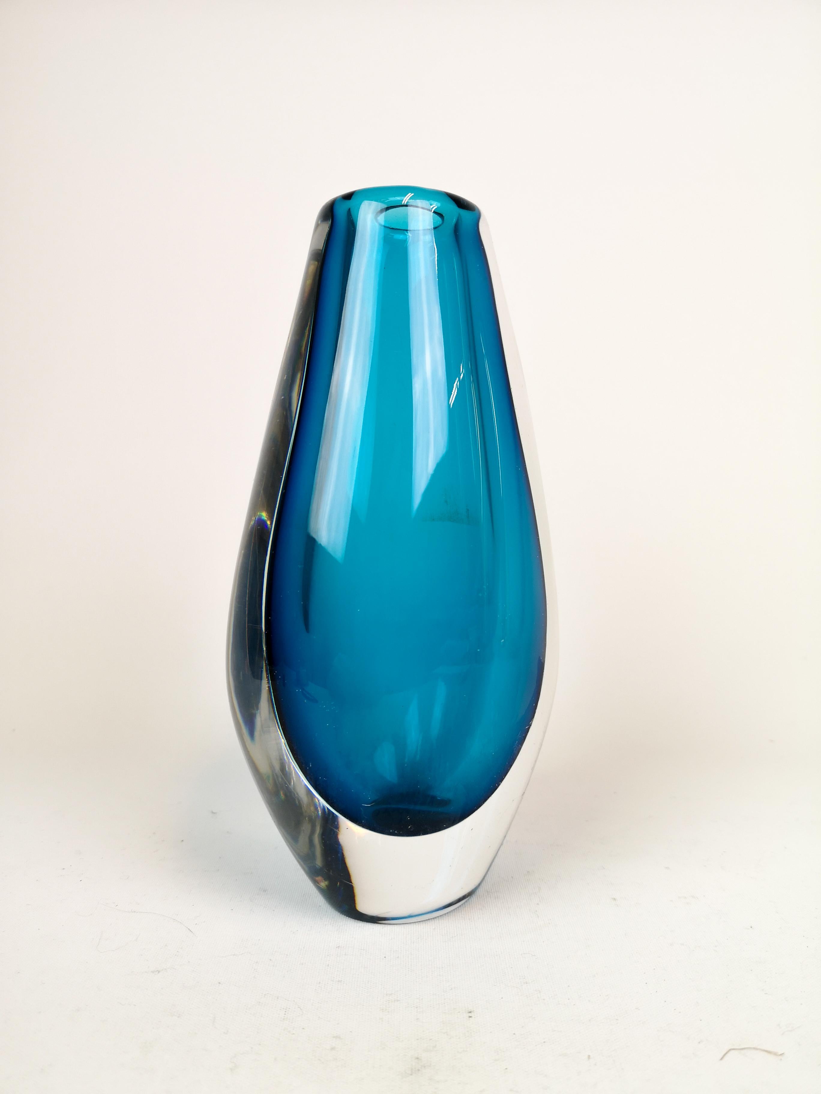 Orrefors heavy dropped formed blue vase, designed by Sven Palmqvist. 
Wonderful glass with exceptional blue color that collaborates with the clear glass. 

 Good condition some small scratches

Measures: H 23 cm. Signed Orrefors pu 3616.
         