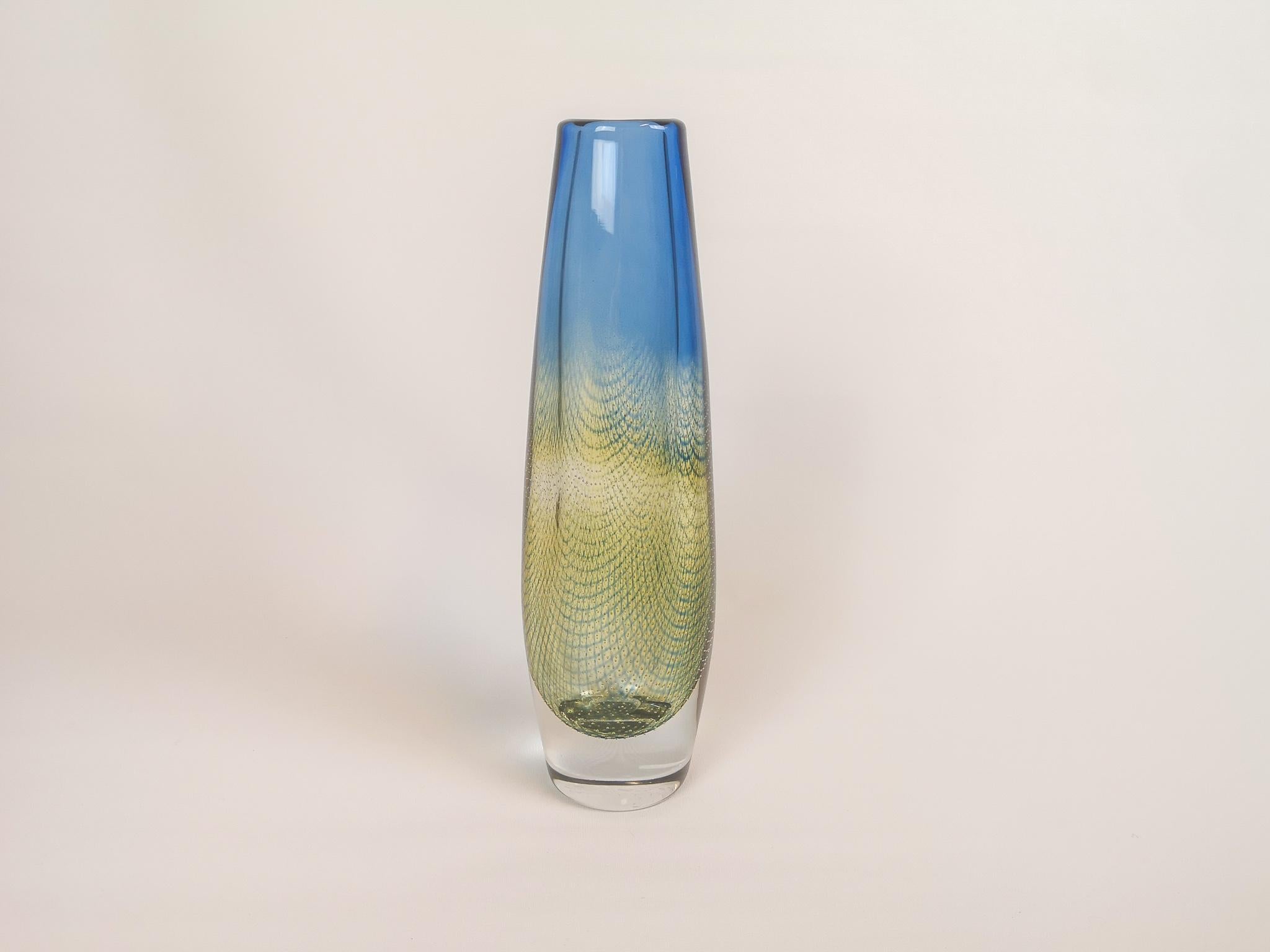 Orrefors blue yellow/green vase, designed by Sven Palmqvist. 
Wonderful glass with exceptional blue and yellow/green color that collaborates with the clear glass. 

 Good condition 

Measures: H 28,5 cm W 10 cm D 7,5 cm. Signed Orrefors S.