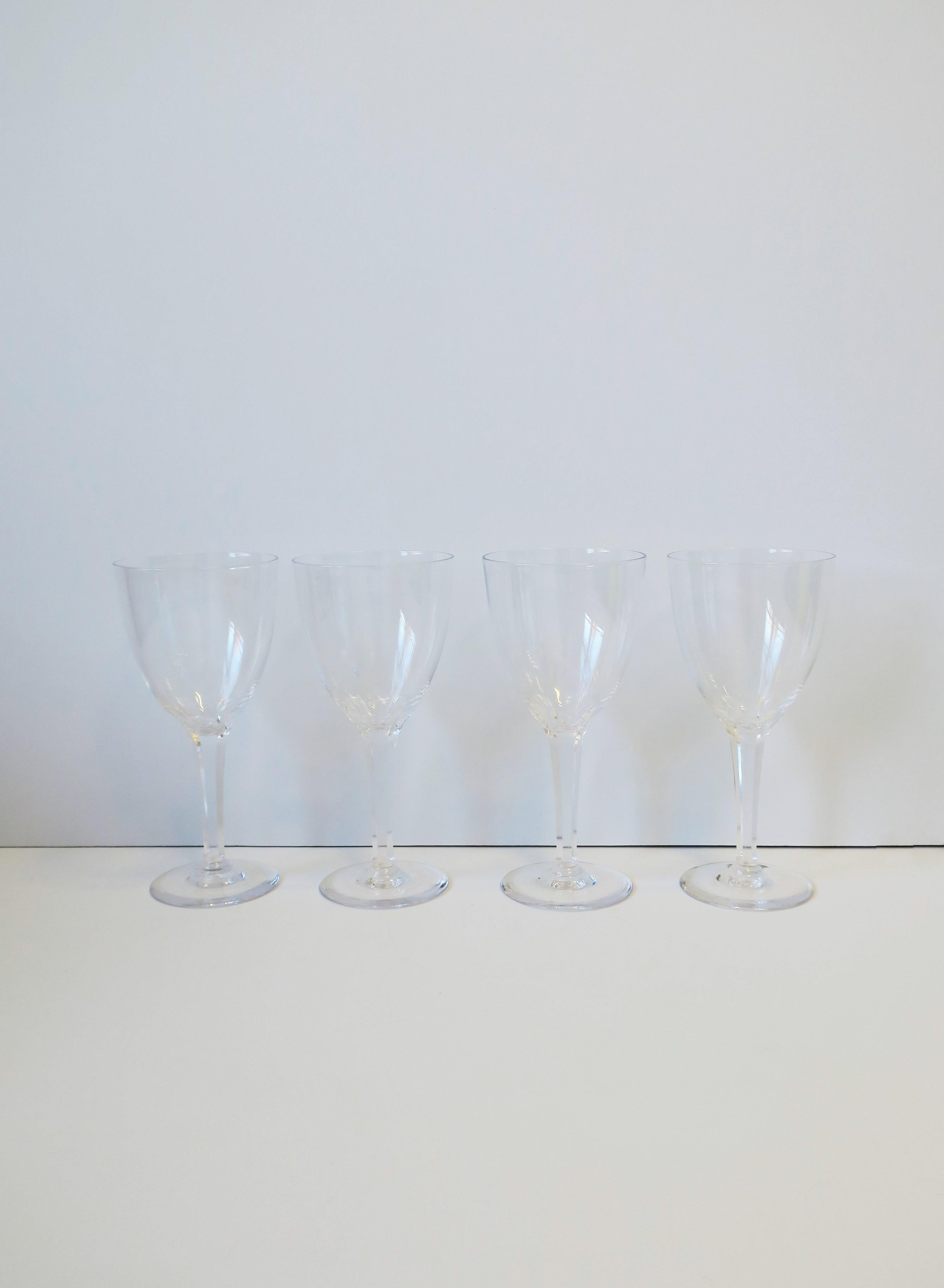 A beautiful set of four (4) rare vintage Kosta Boda crystal wine or water glasses, Midcentury Modern period, circa mid-20th century, Sweden. With maker's mark etched 