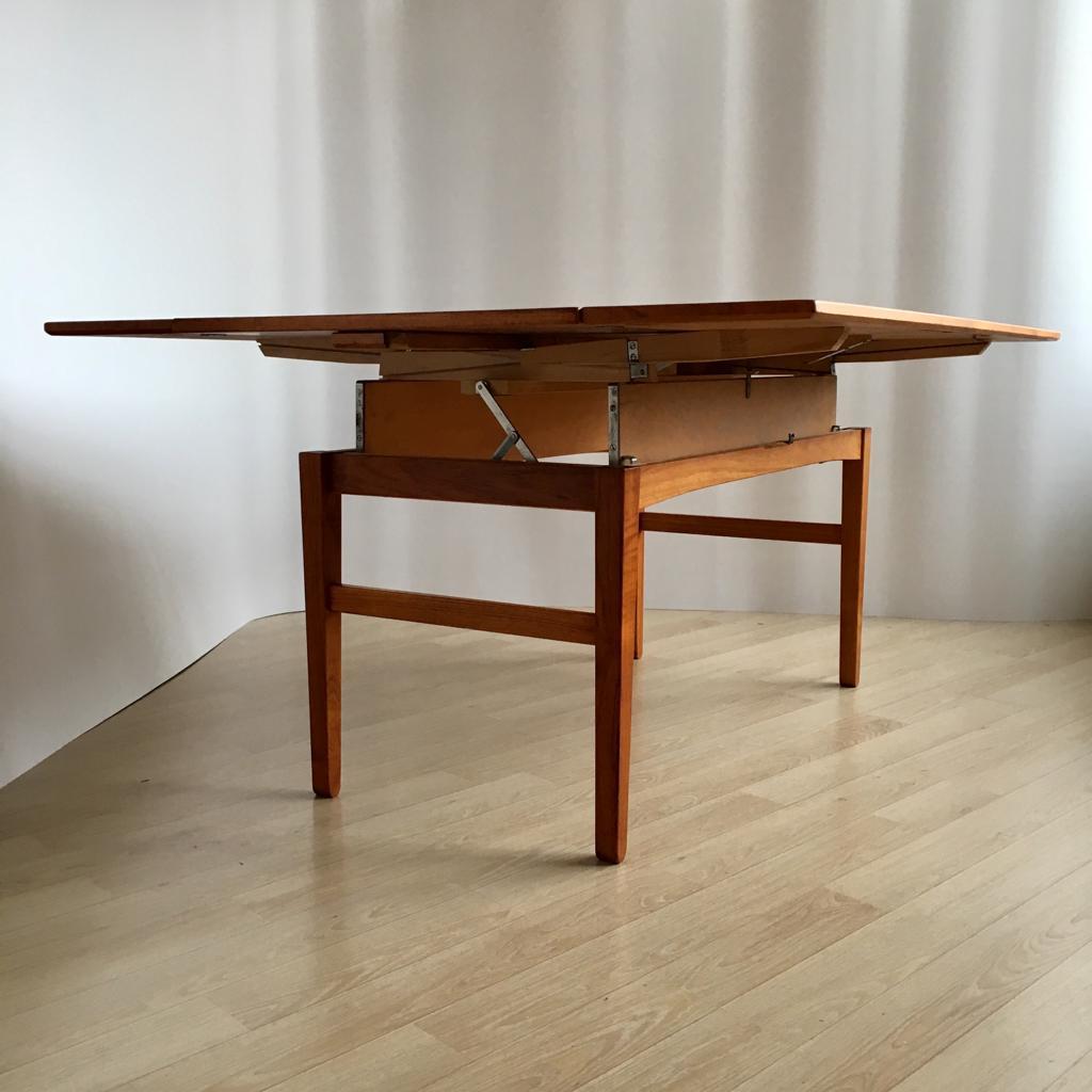 This table was designed by O. Carlsson for Emmaboda Möbelfabrik in 1957. The tabletop can be elevated and extended.

Dining table - H 71 cm, W 143 cm, D 113 cm
Coffee table - H 57 cm, W 143 cm, D 61 cm.