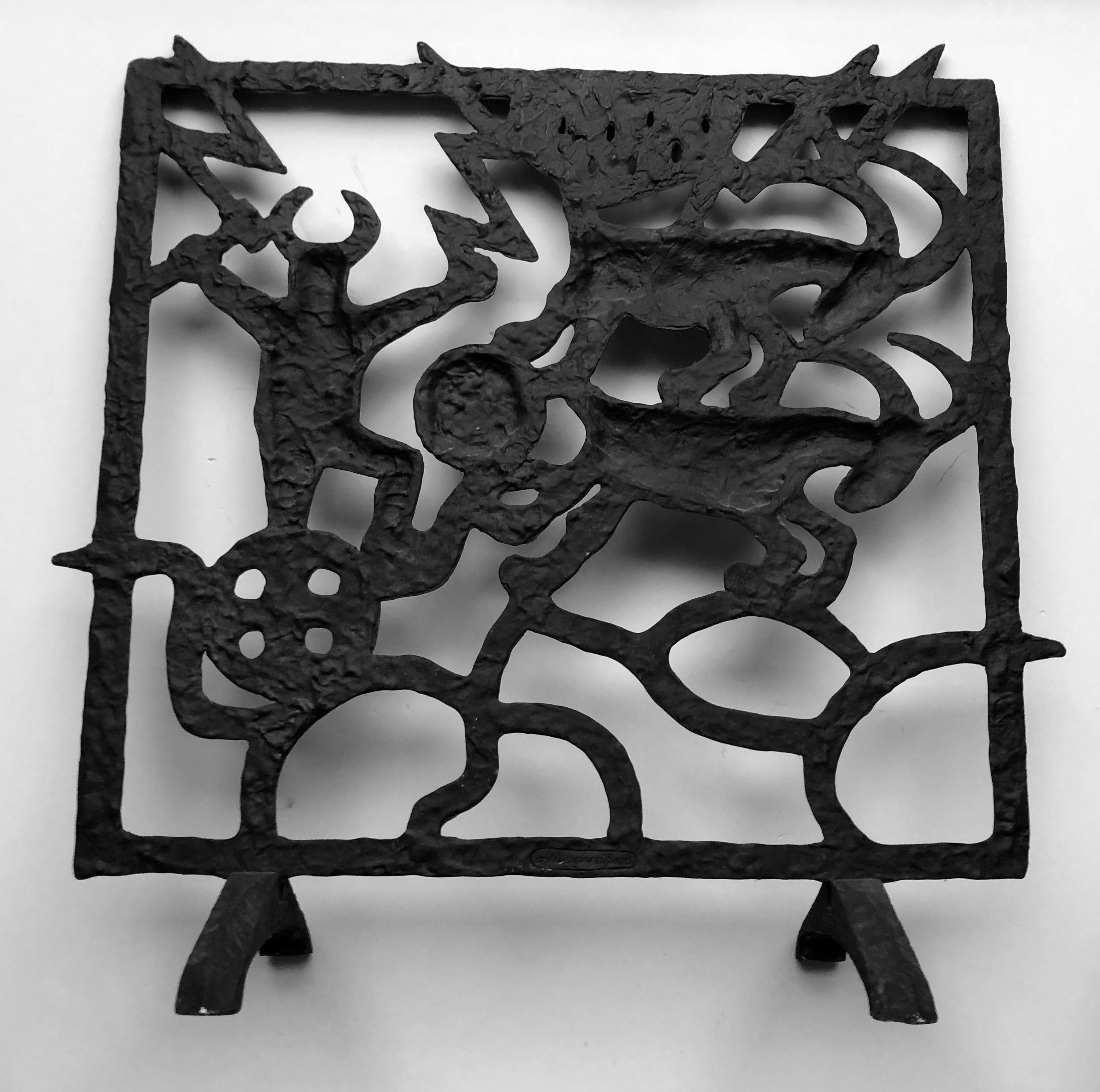 Midcentury Swedish fireplace screen by Olle Hermansson for Husqvarna. Note. This screen is wall-mounted, unlike the freestanding ones. A cast iron fireplace with a theme from the nordic mythology. We can see Thor (Tor) and his running goats and the