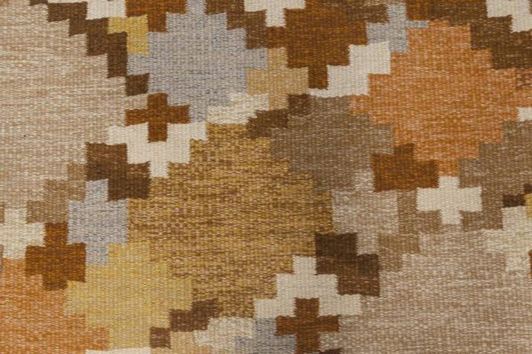 Mid-20th century Swedish brown, beige, grey, blue flat-weave wool rug by Ingegerd Silow
Size: 5'6