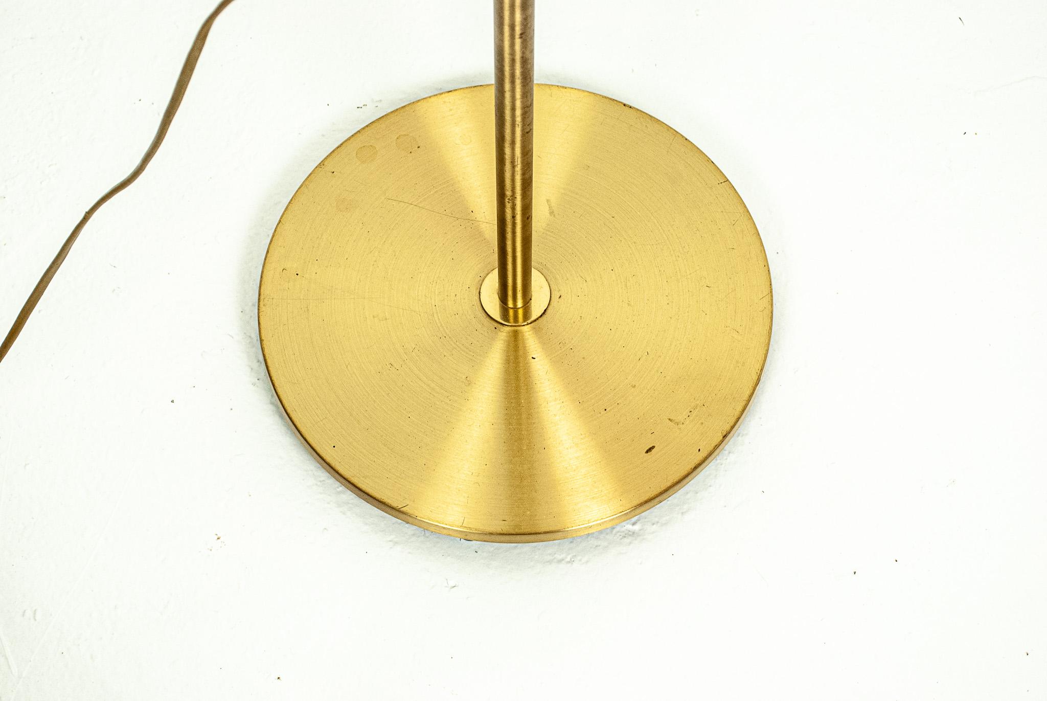 Swedish midecentury lamp in textile and brass. 