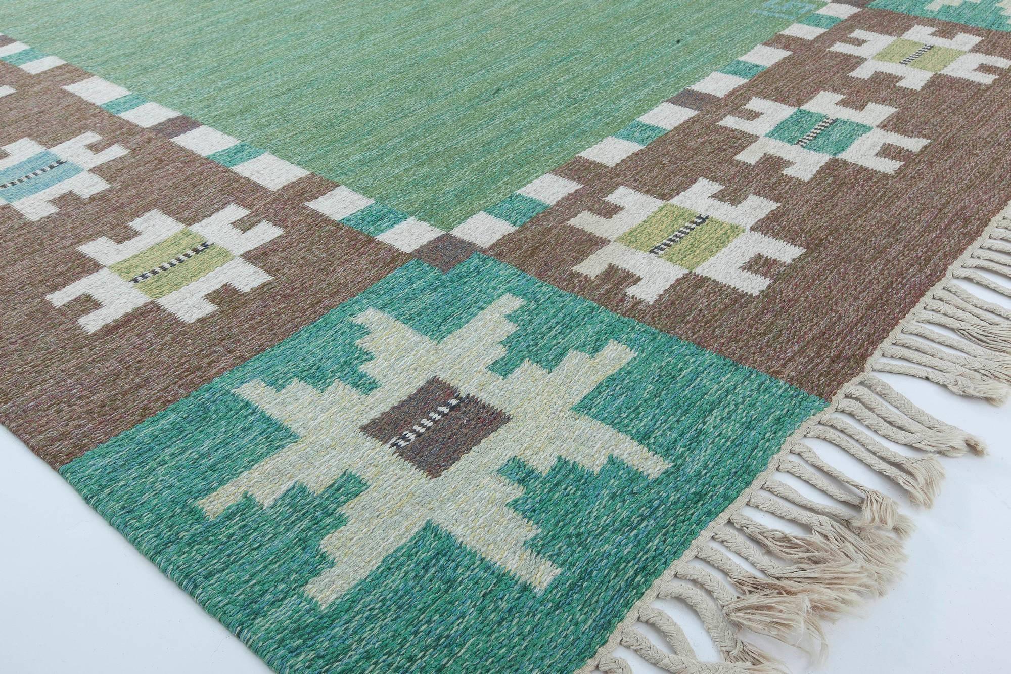 Mid-20th century Swedish garden design rug by Ingegerd Silow in green, brown, and ivory. Woven signature 'IS'
Size: 5'4