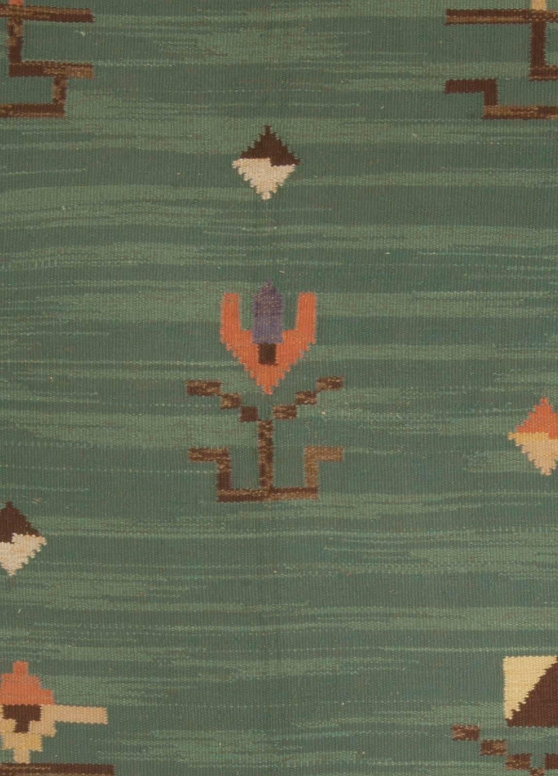 Mid-20th century Swedish green handmade wool rug
Size: 10'6
