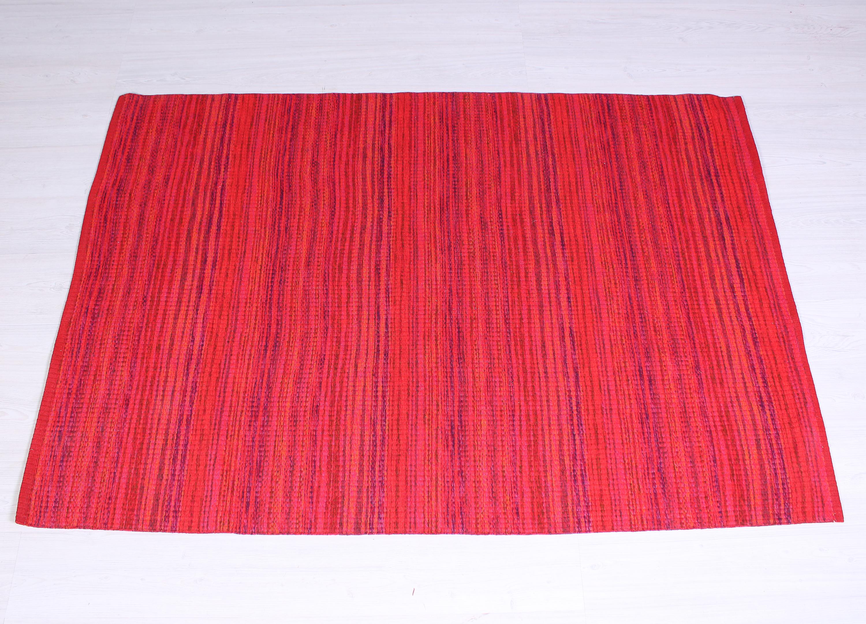 A vibrant red midcentury carpet made in Sweden during the 1960s. The carpet is made with double weave technique and is in very good vintage condition. Perfect piece to bring some color into the home.