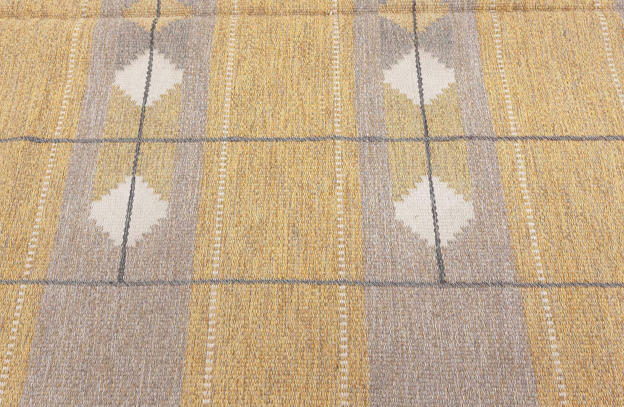 Mid-20th century Swedish yellow flat-weave wool rug
Size: 5'5