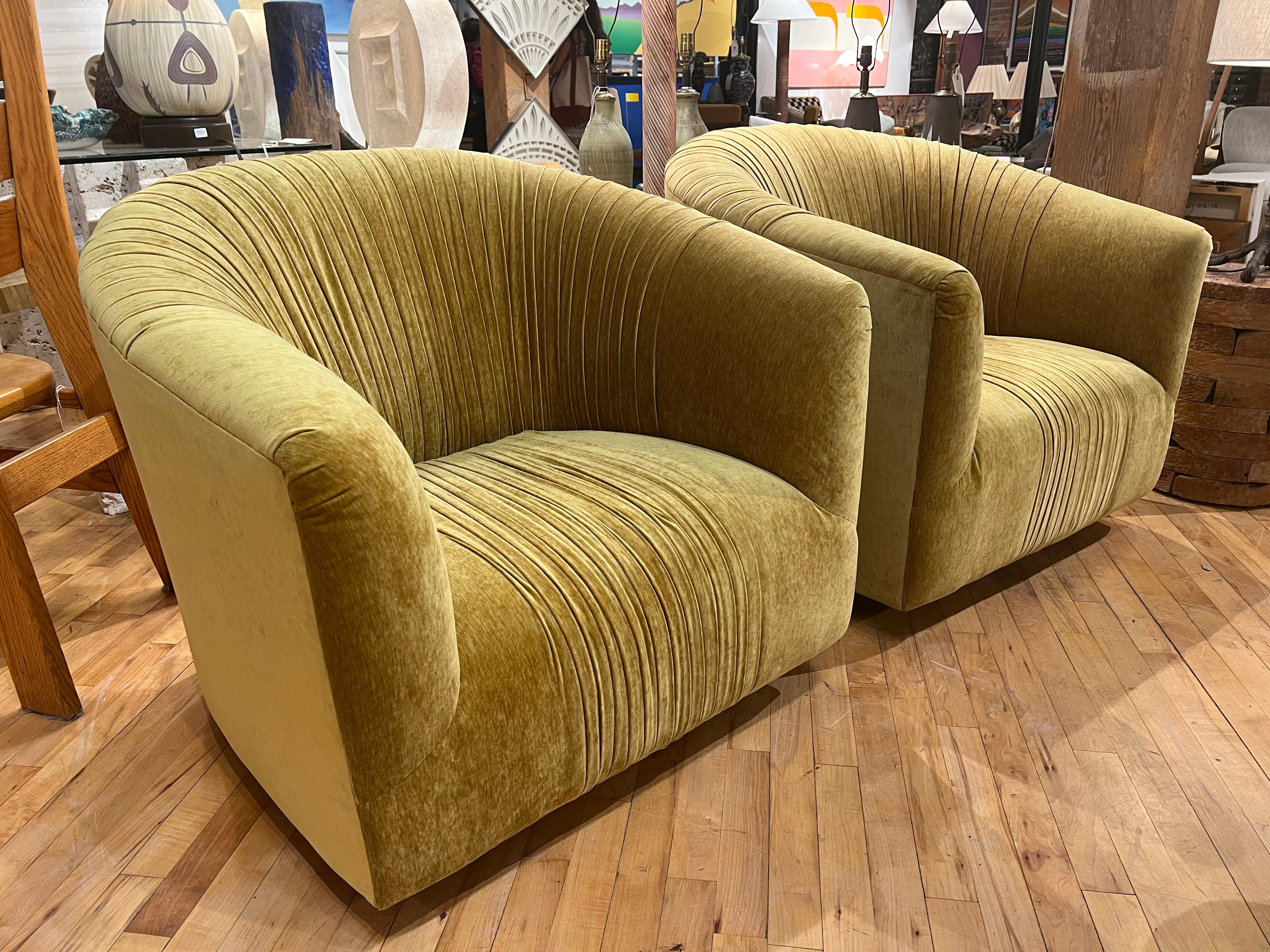 Mid-century swivel lounge chairs redone in chenille. Custom upholstery.