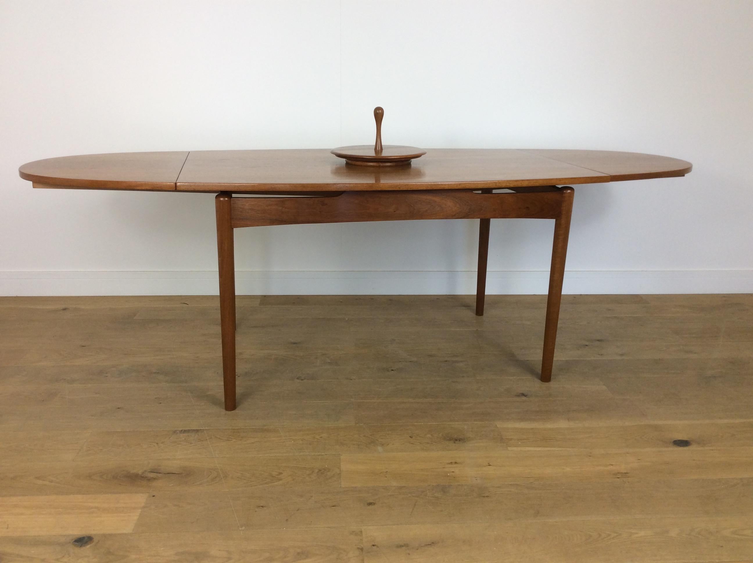Midcentury dining table.
Midcentury teak extendable dining table with Lazy Susan.
Measures: 75.5 cm H, 137 cm W, 95 cm D each leaf is 50 cm giving an extension to 187 cm or 237 cm, the Lazy Susan is 35 cm diameter, this can be lifted out if not