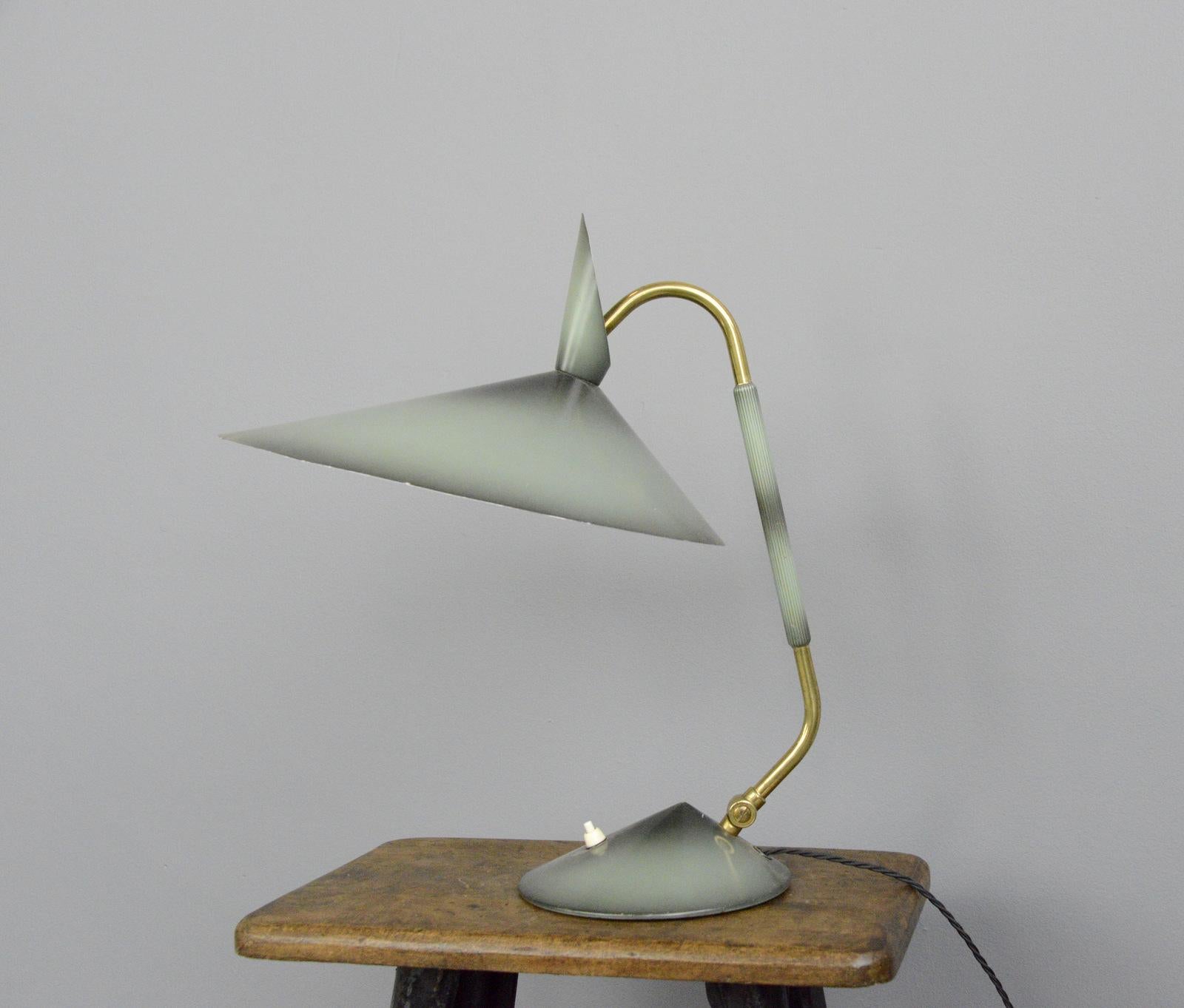 Midcentury table lamp by Helo, circa 1960s

- Original 2-tone black and blue paint
- Brass adjustable arm
- Aluminium shade
- Takes E27 fitting bulbs
- On/Off push button switch on the base
- Made by Helo
- German, 1960s
- Measures: 49cm