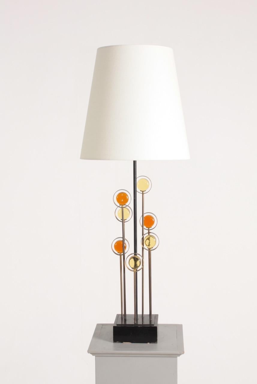 Rare table lamp in metal and art glass on a wood base, designed and made by Svend Aage Holm Sorensen. Great original condition.