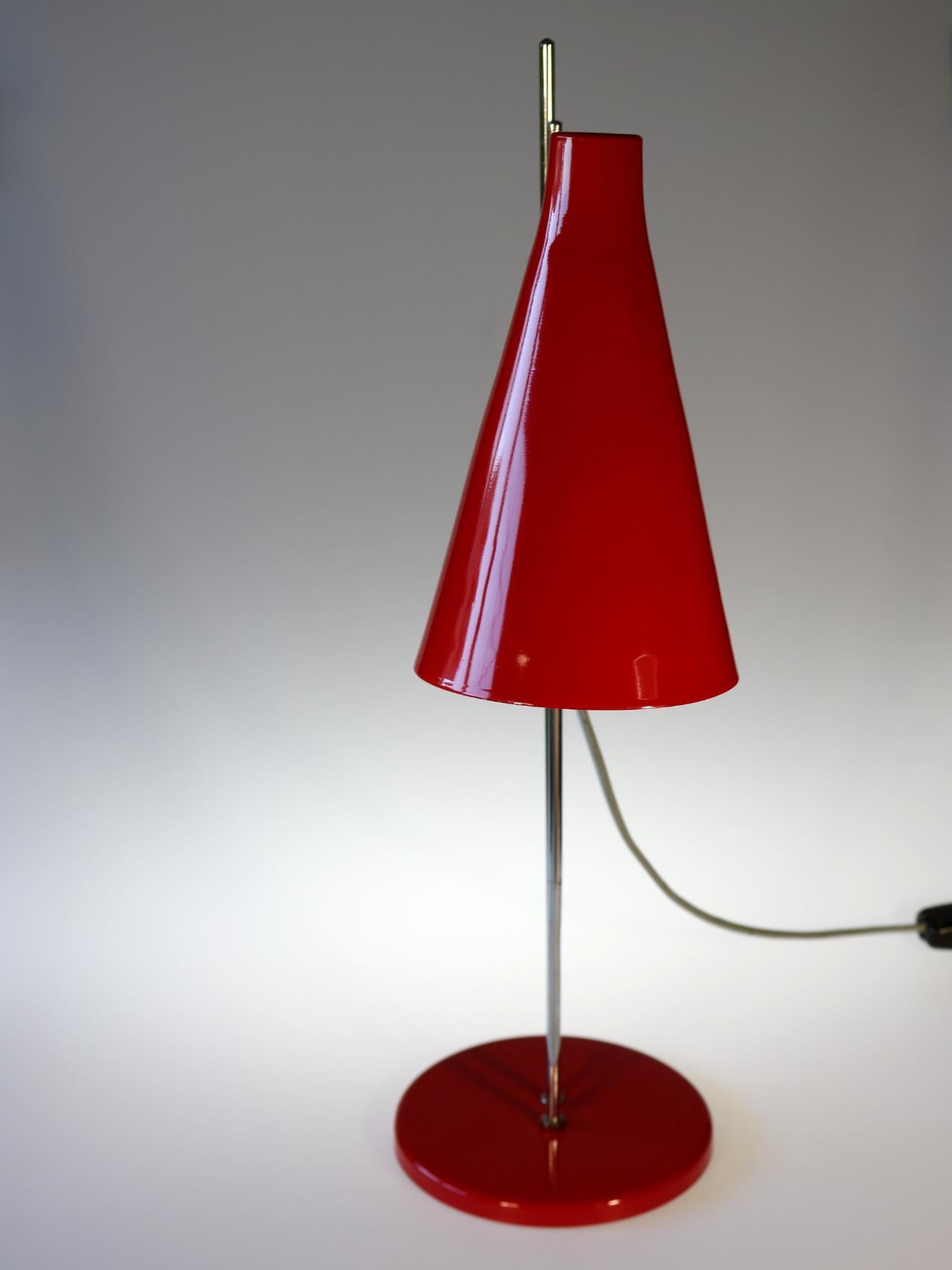 Midcentury table lamp designed by Josef Hurka for Lidokov. Chrome-plated construction in good condition, lampshade adjustable to the sides and up and down. Lampshade material aluminum.
