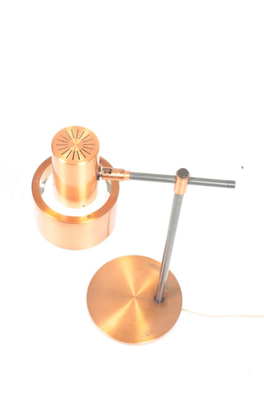 Table lamp in copper, designed by Jo Hammerborg and made by Fog & Mørup, in the late 1960s.
 