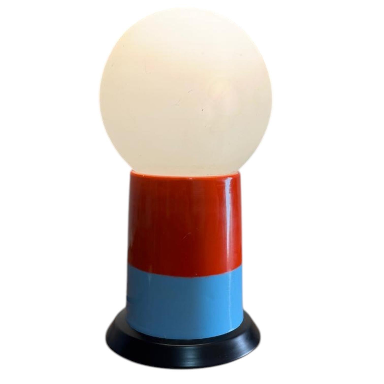 The base is made of  lacquered aluminium. A minimalist 1970s design is enhanced by the bright color of the metal base. Perfect as a side table or desk lamp.
Excellent condition. Clean, sound, and in perfect working order. 