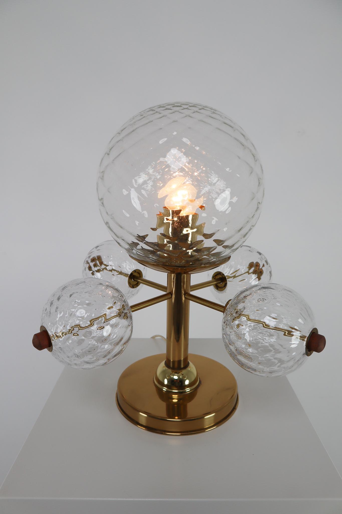 Table lamp with brass fixture and structures glass. This lights are beautifully decorated thanks to the structured glass. The pleasant light it spreads is very atmospheric, these lights will contribute to a luxurious character of the interior. The