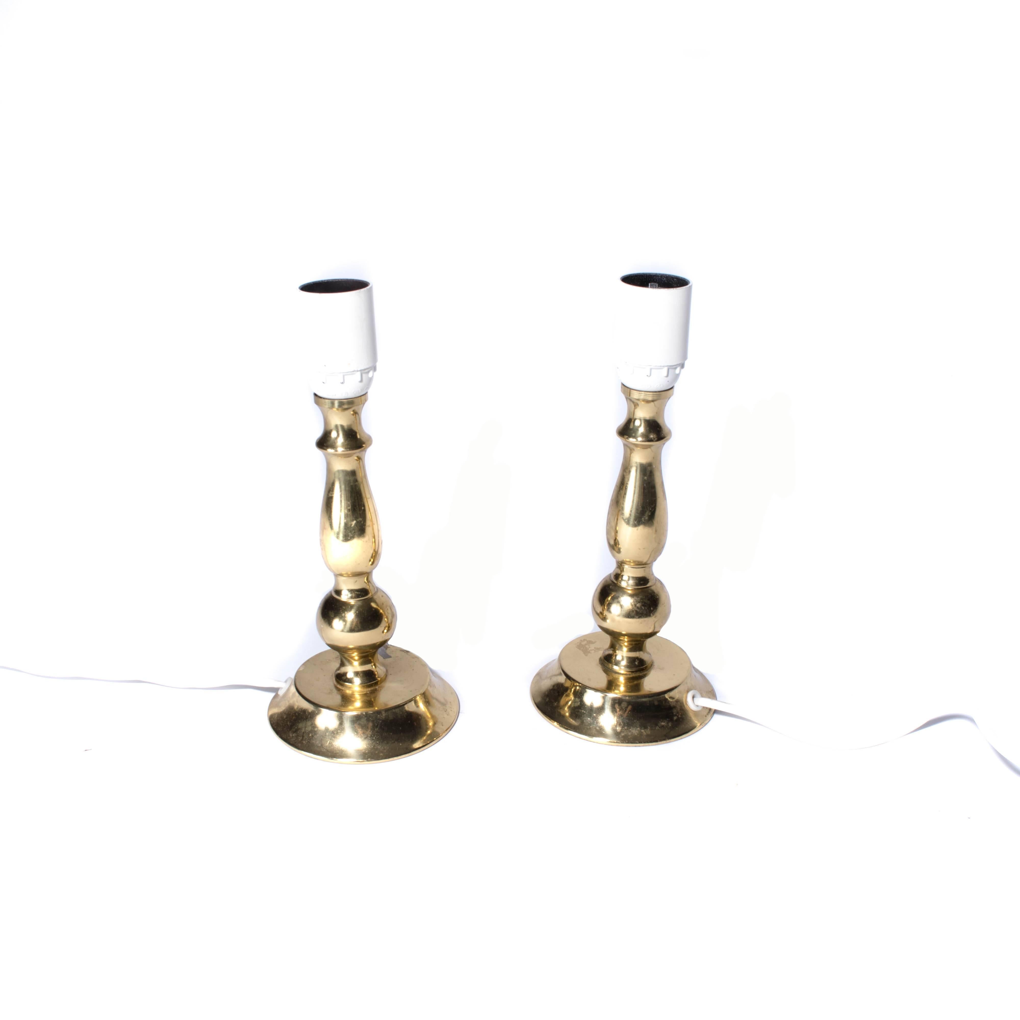 Small table lamps in brass. Very cute for any bedroom or living room.