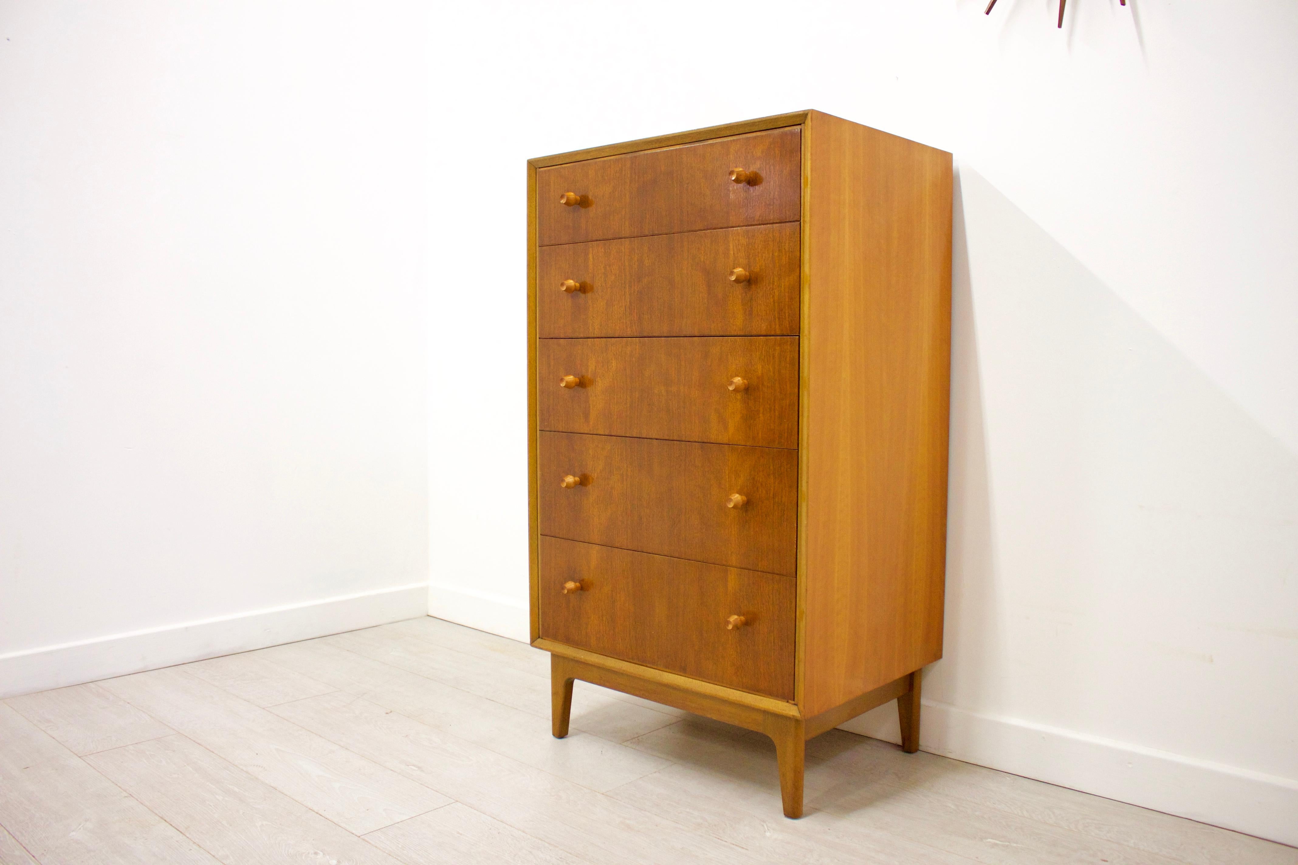 - Midcentury chest of drawers
- Manufactured in UK by Vesper
- Made from solid teak and walnut veneer
- Features 5 drawers for ample storage.