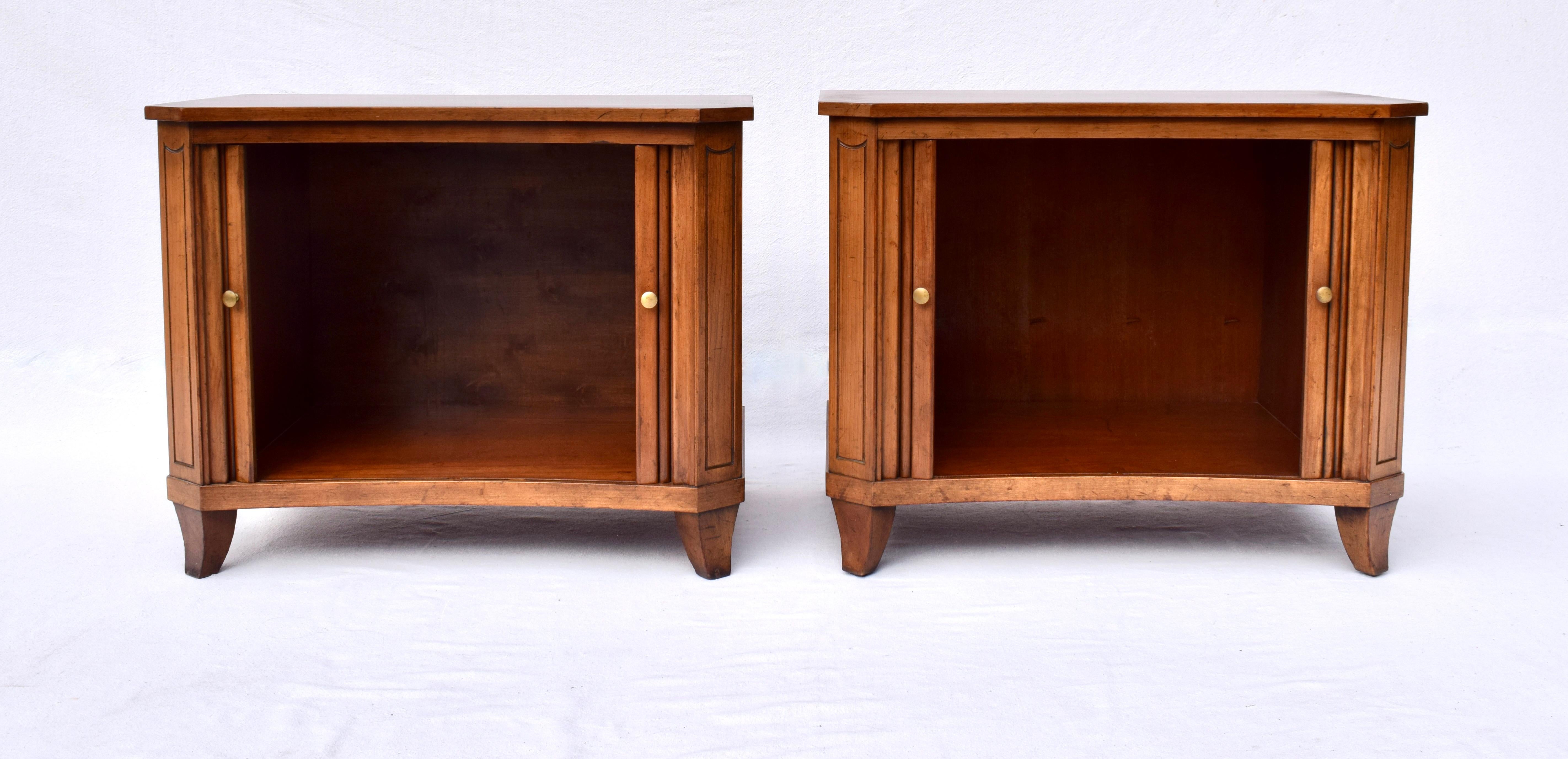 Impressive mid 20th century Baker Furniture tambour door nightstand cabinets with curved fronts. Newly refinished tops ready for use. Each retains the original Baker medallion.