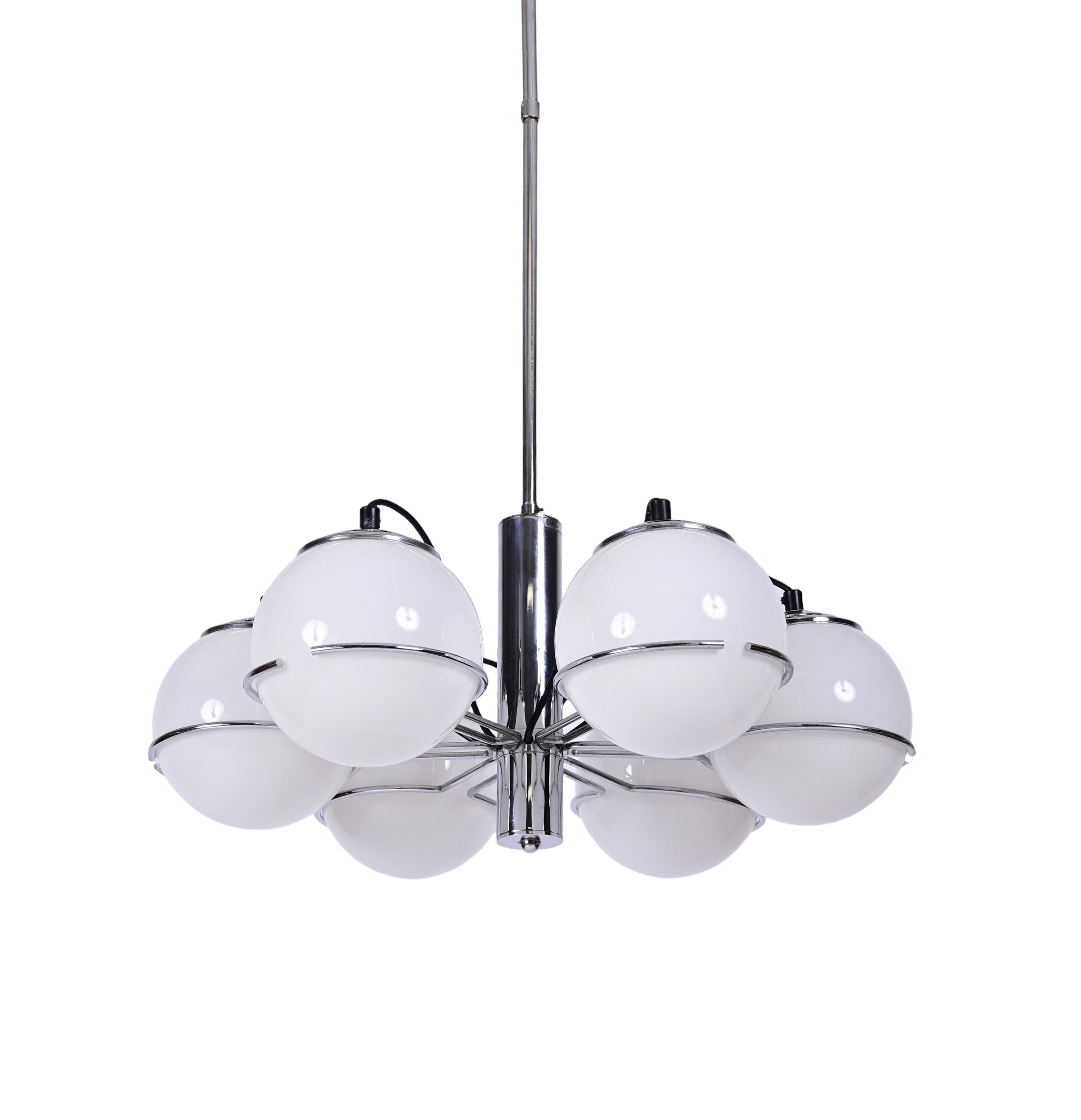 Amazing midcentury chrome and opaline white glass chandelier. Targetti Sankey designed this fantastic piece in Italy during the 1970s.

This item is fantastic as it comes with six white glass opal globes, floating in the chromed frame and a
