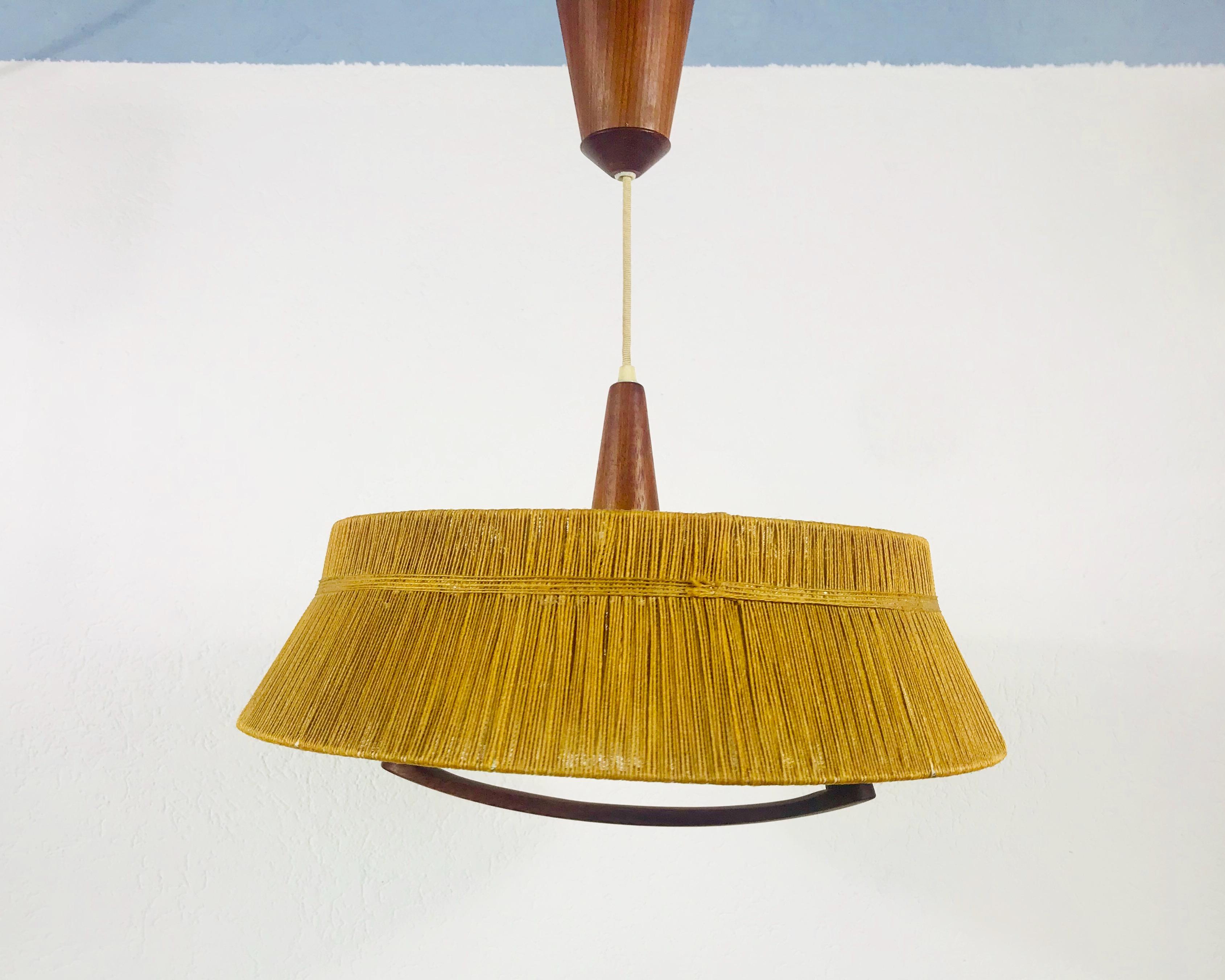 A wonderful Scandinavian teak hanging lamp made in the 1960s. It is fascinating with its rare cord shade. The rope of the lamp is also height adjustable. The height is min 50 cm and max 150 cm. It has a perspex diffuser at the bottom.


The light