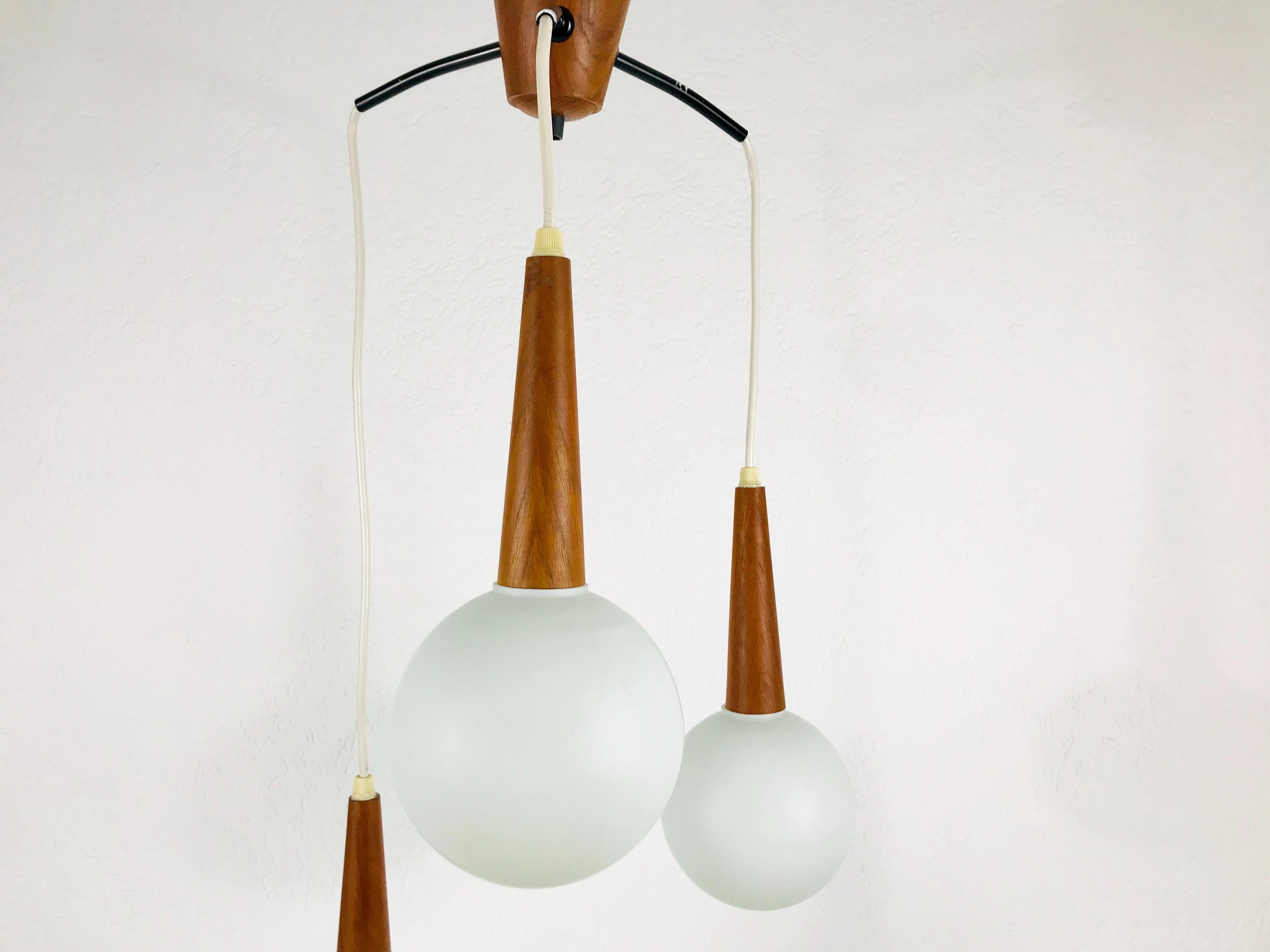 Swedish Midcentury Teak and Opaline Glass Cascade Pendant Lamp Attributed to Luxus 1960s