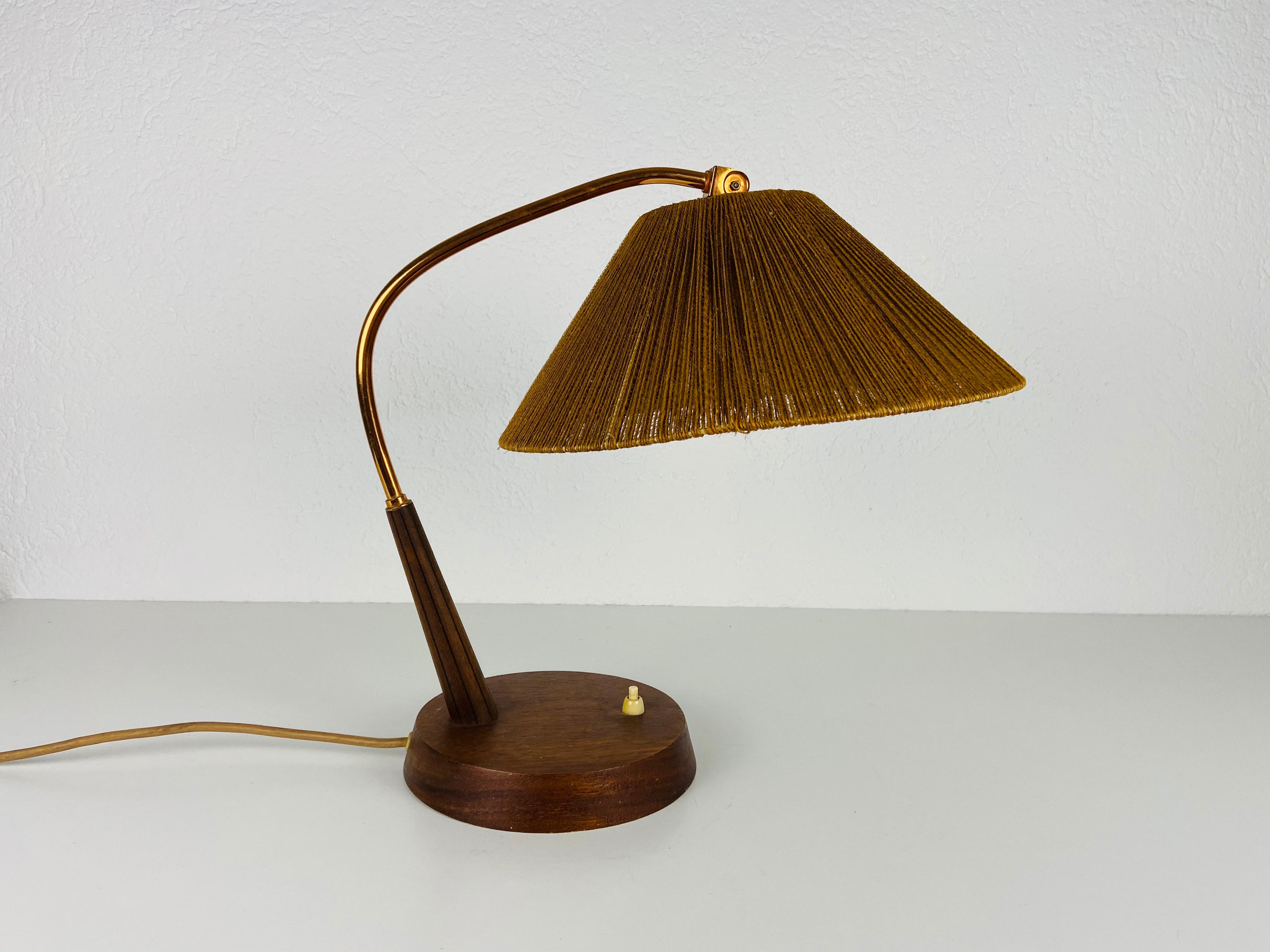 A wonderful teak table lamp made in the 1960s by Temde in Switzerland. It is fascinating with its rare lamp shade.

The light requires one E27 (US E26) light bulb. Very good vintage condition.

Free worldwide express shipping.