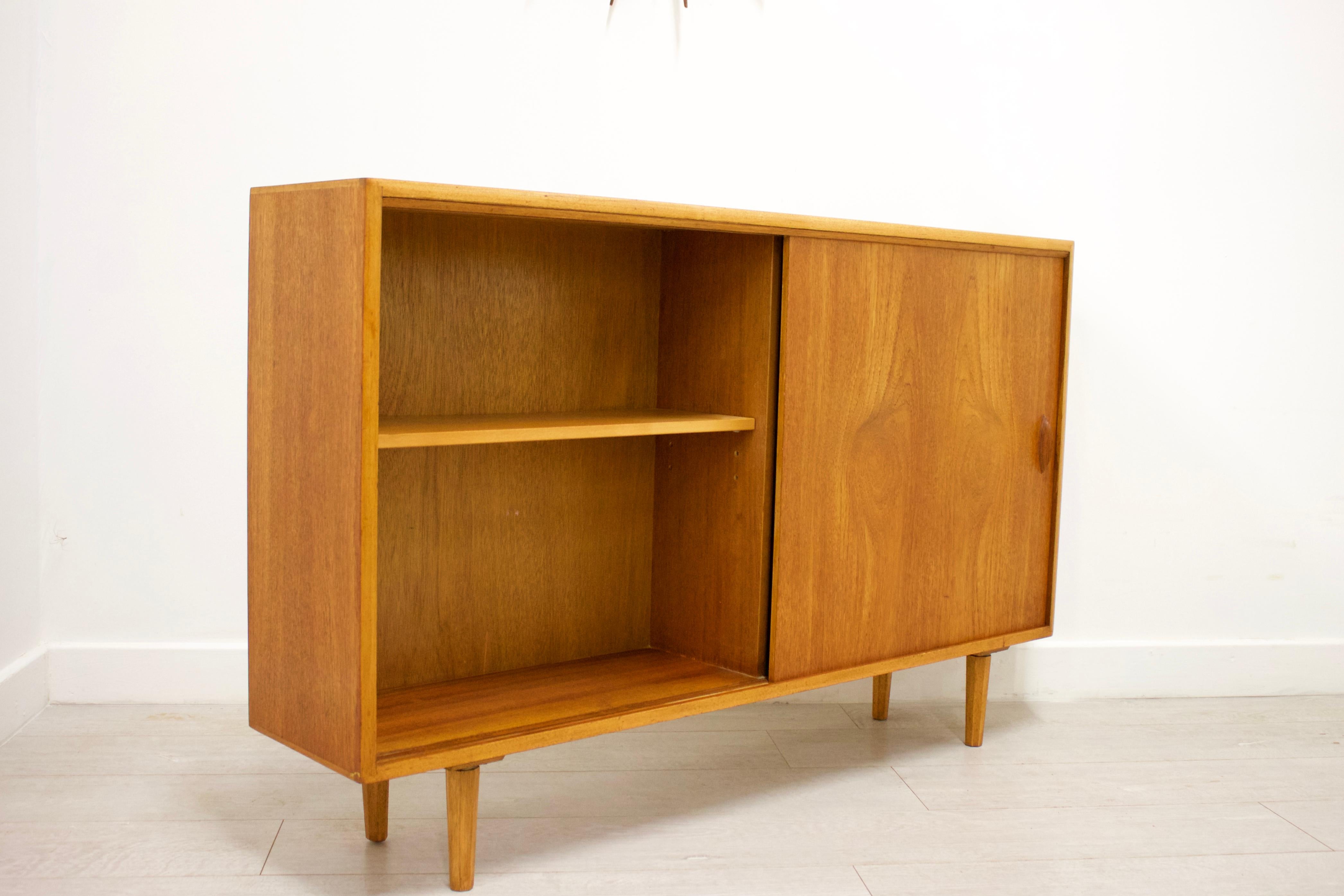 Midcentury design
 
Midcentury bookcase
Made in the UK 
Made from teak and teak veneer.

  