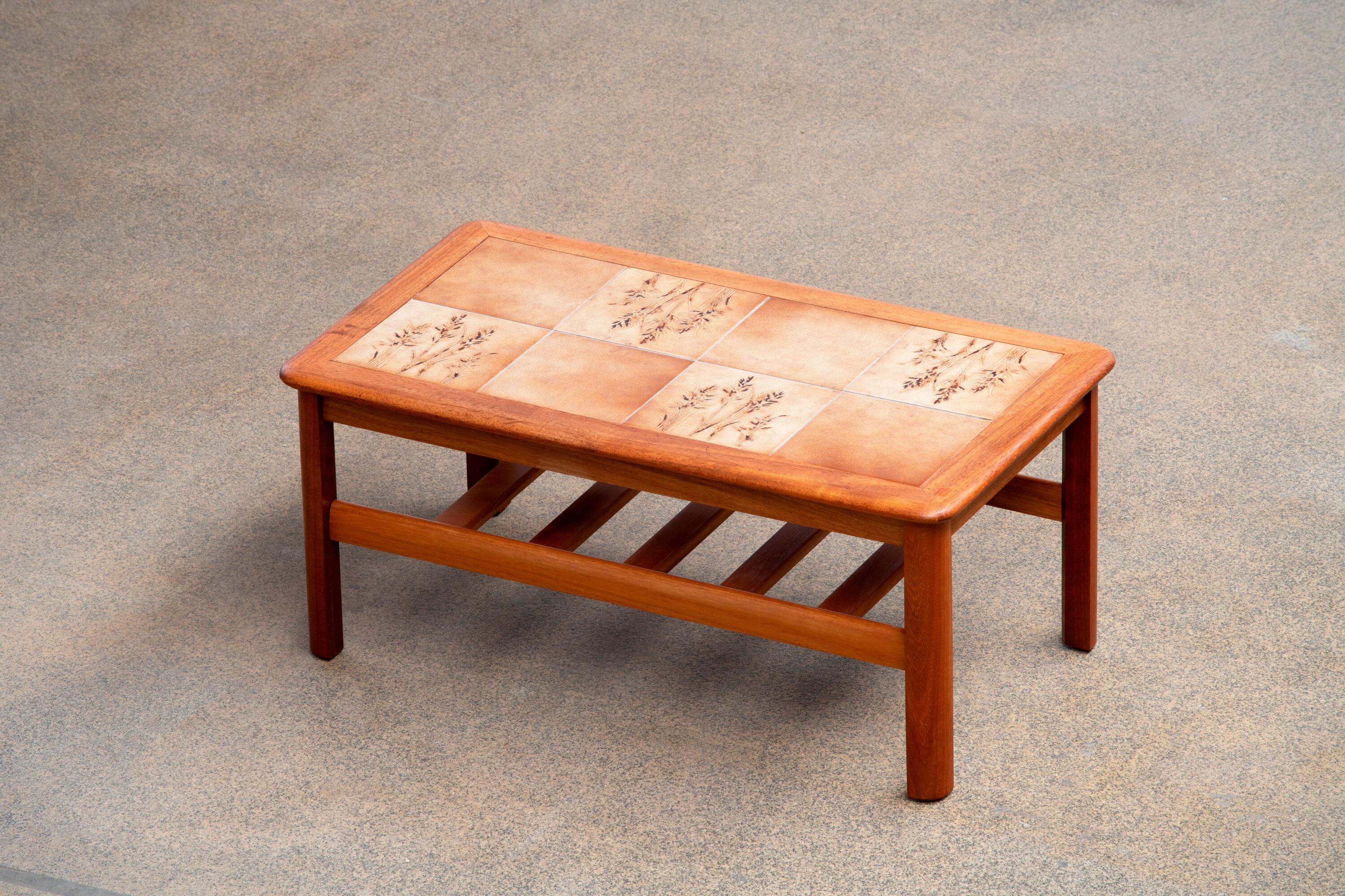 Mid-century coffee table in teak and ceramic.
1960s.