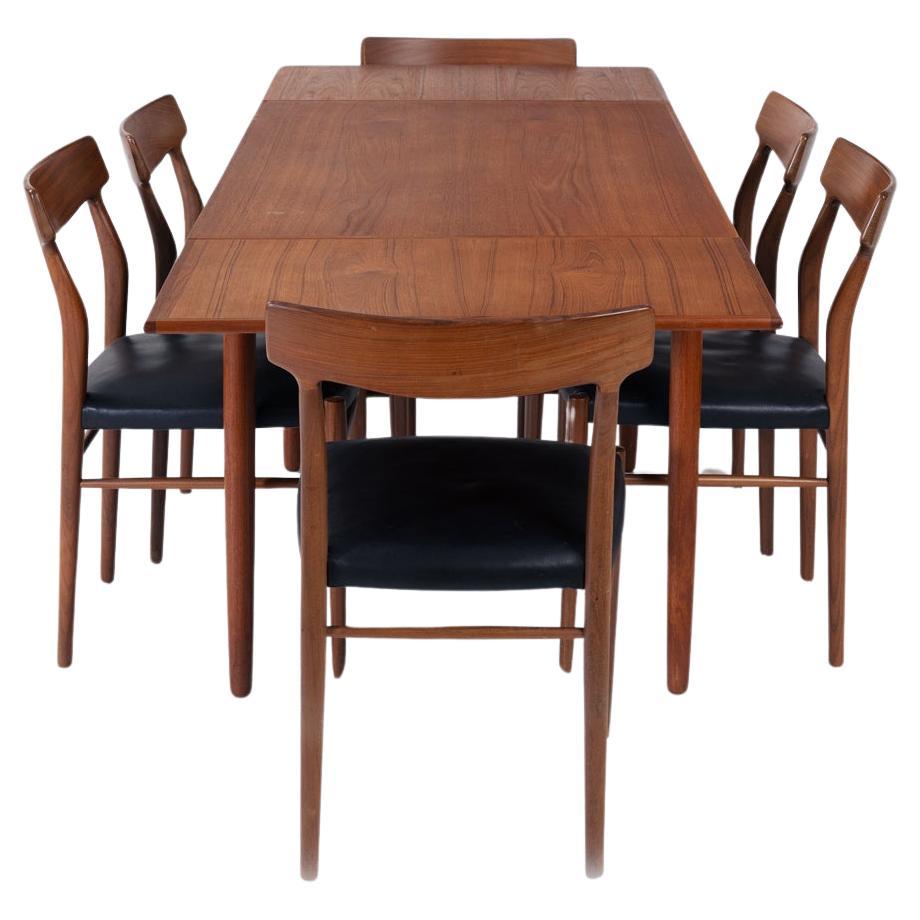 midcentury teak design set with extendable table and 6 organic shaped chairs For Sale