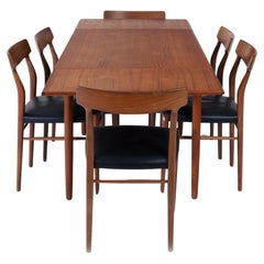 midcentury teak design set with extendable table and 6 organic shaped chairs