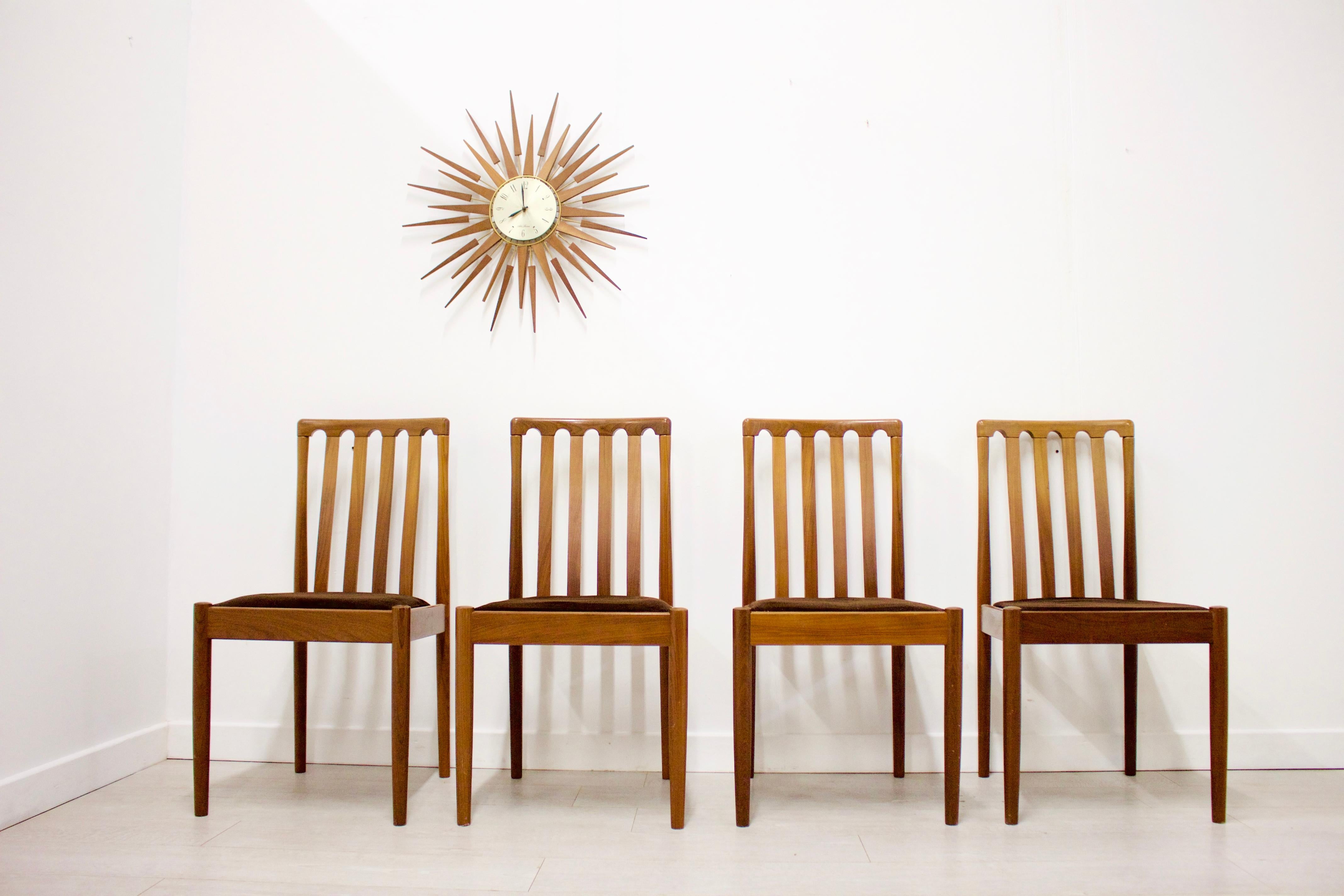 - Mid-Century Modern set of 4 dining chairs
- Made by Meredew
- Featuring brown upholstery
- Made from teak
- Measures: Seat height 44.5 cm.