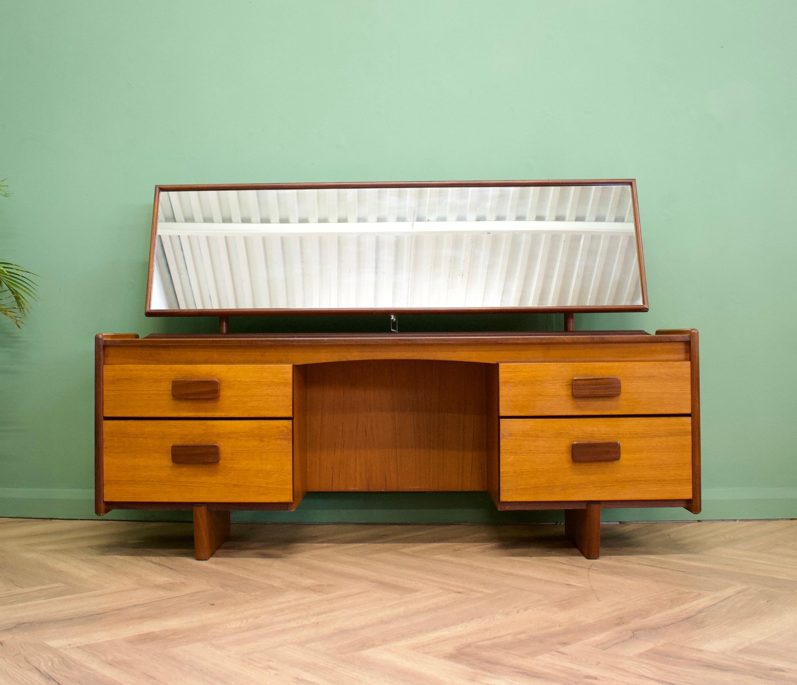 - Mid century dressing table.
- Made in the UK by White and Newton
- Featuring four drawers and mirror.

.